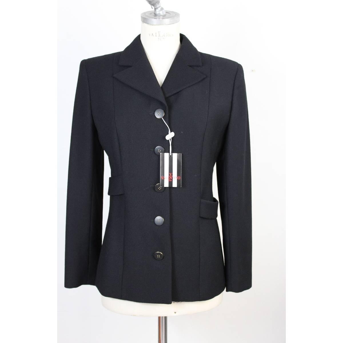 Valentino suit jacket and trousers black pure wool, new with tag. The jacket has a belt behind the back. The pants with raw cut on the hem, two pockets on the sides and band on the length. New with tag. Made Italy

Size 42 It 8 Us 10 Uk

Shoulder: