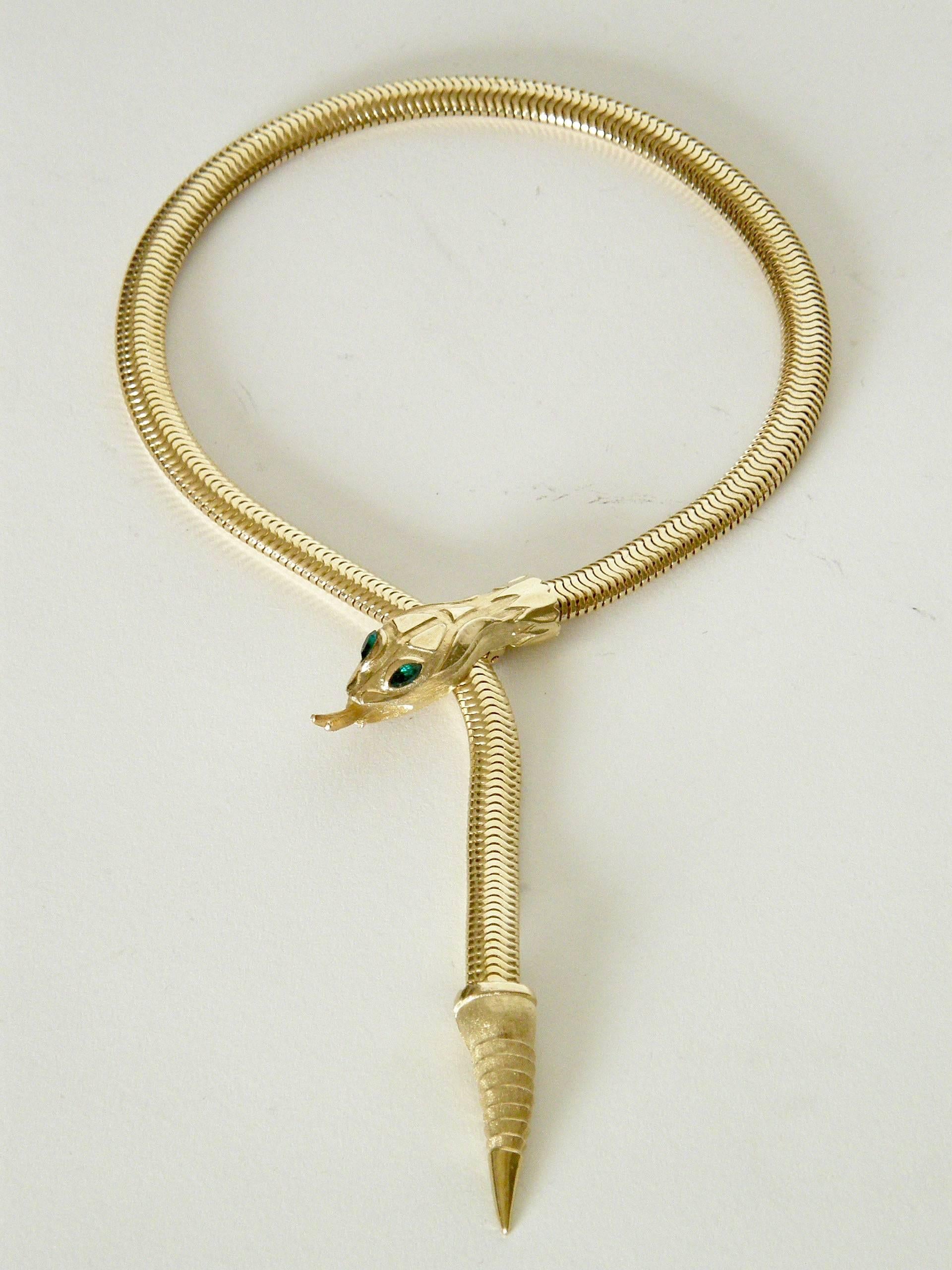 This sleek, rattlesnake necklace and bracelet set designed by Francois for Coro is new/old stock with its tag still attached. The heavy snake chain lies nicely and moves beautifully. The clasp for the necklace is a clip behind the snake's head, and
