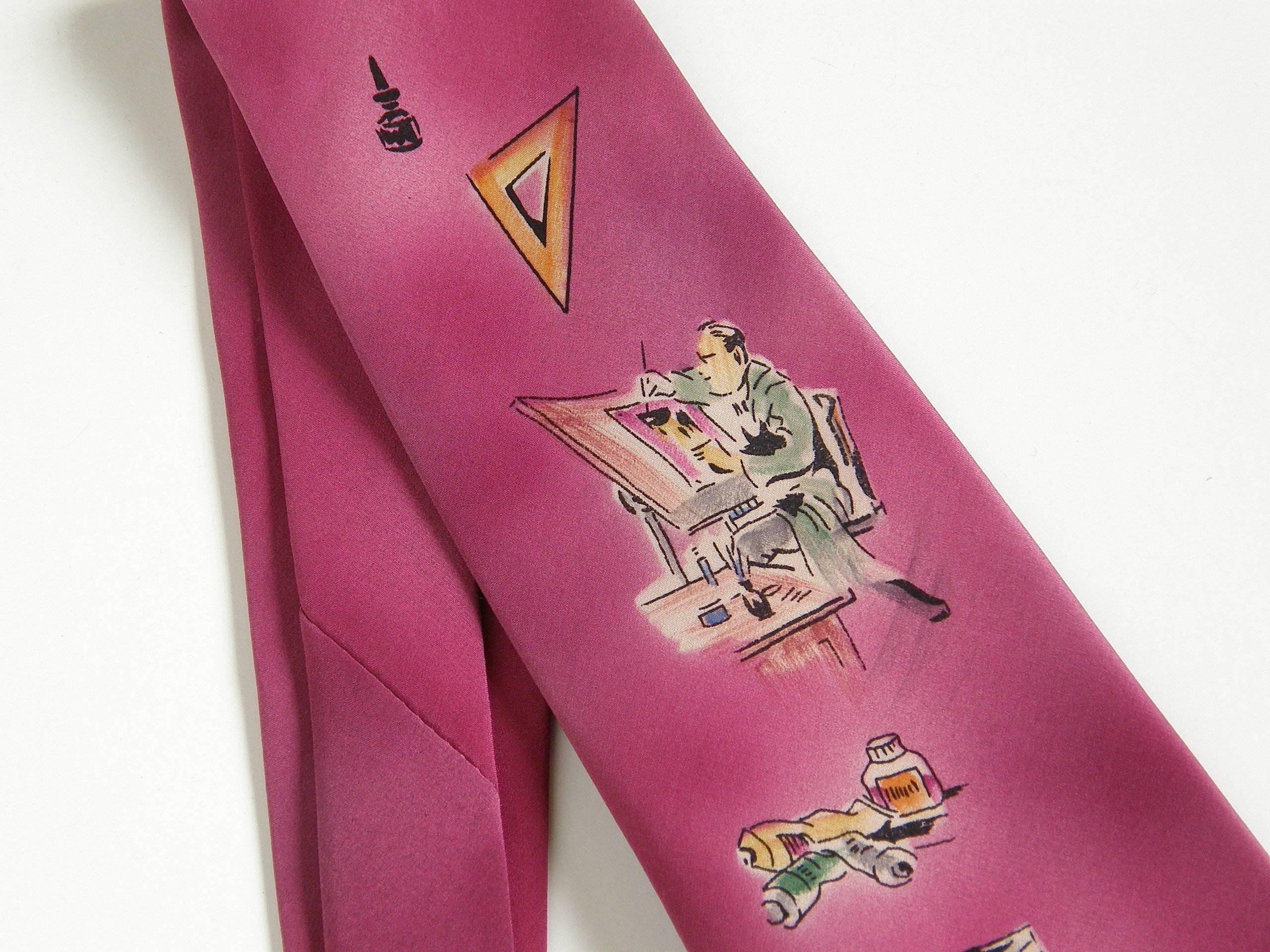 This wonderful, hand painted silk necktie features an image of an artist or designer at his drafting table. He is surrounded by the tools of his trade, including paints, ink, brushes and squares. The background is airbrushed in fuchsia and magenta