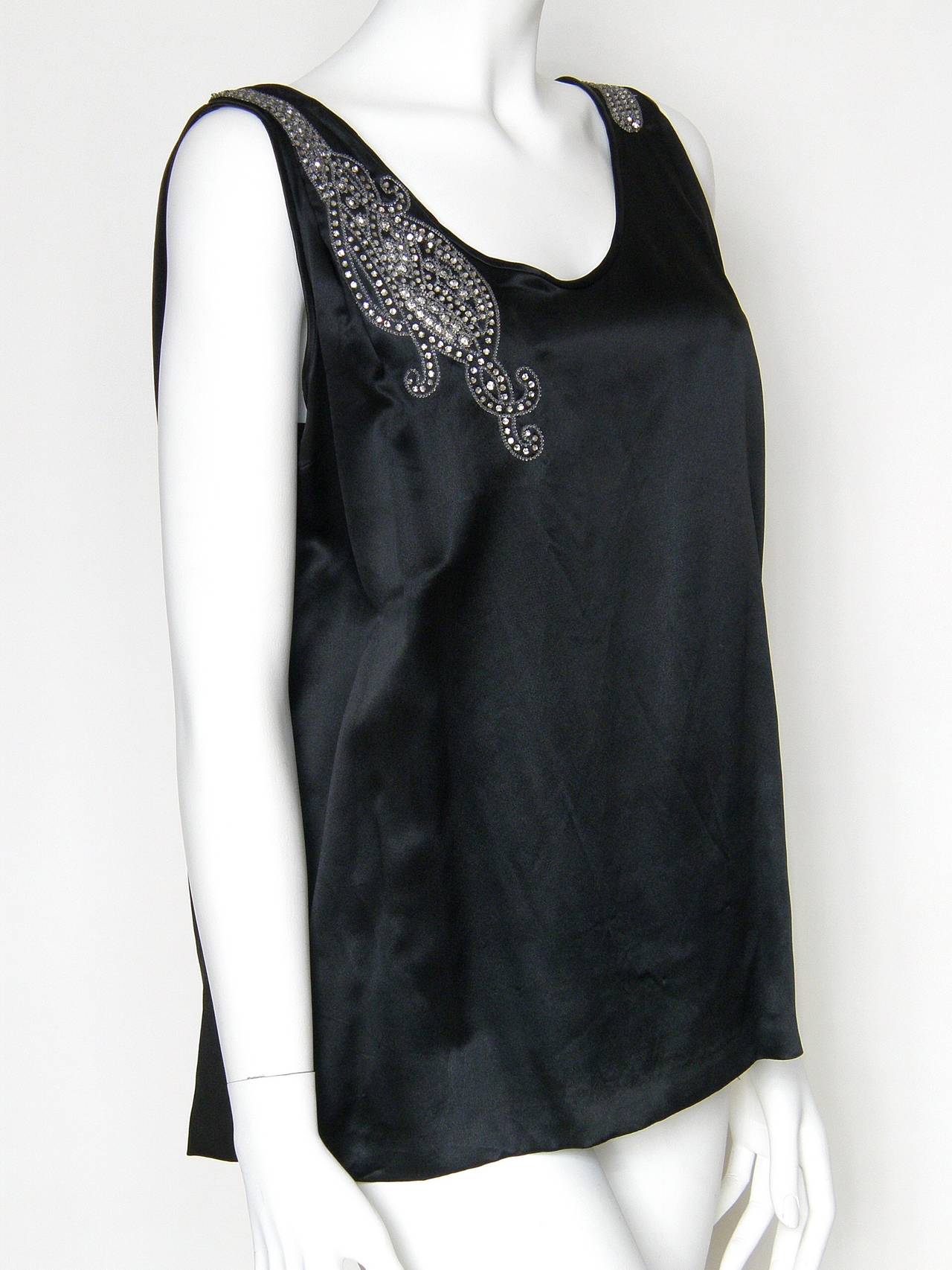 Elegant black sleeveless evening blouse with a deep 
