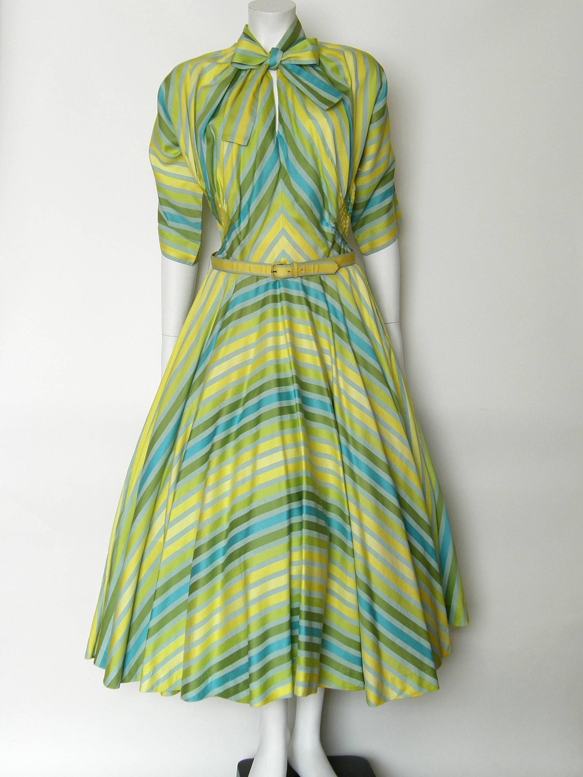 This striped cotton garden party dress was designed for Townley by Claire McCardell, who was hugely influential in bringing comfort to chic and modern clothing for women. She used the stripes to wonderful effect with the mitered, chevron pattern of