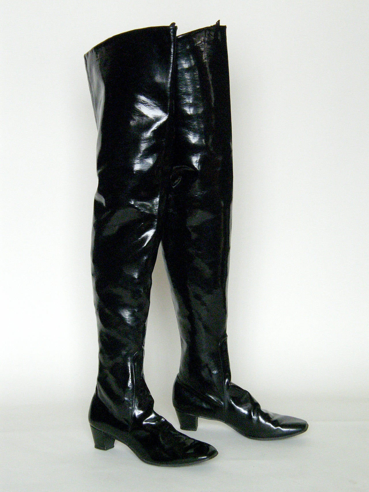 Sexy, thigh high Beth Levine boots in glossy black, stretch vinyl. Beth Levine was renowned for her boot designs in the mini skirt era. She designed the boots that Nancy Sinatra wore to sing 