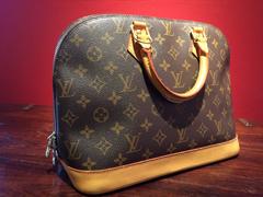 Monogramed Alma PM Handbag