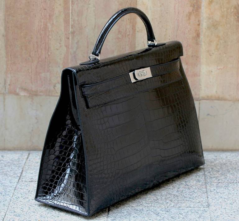 HERMES Kelly crocodile black 40cm 2014, palladium hardware, comes  with complete packaging and accessories, original invoice.   Pristine, unworn condition.