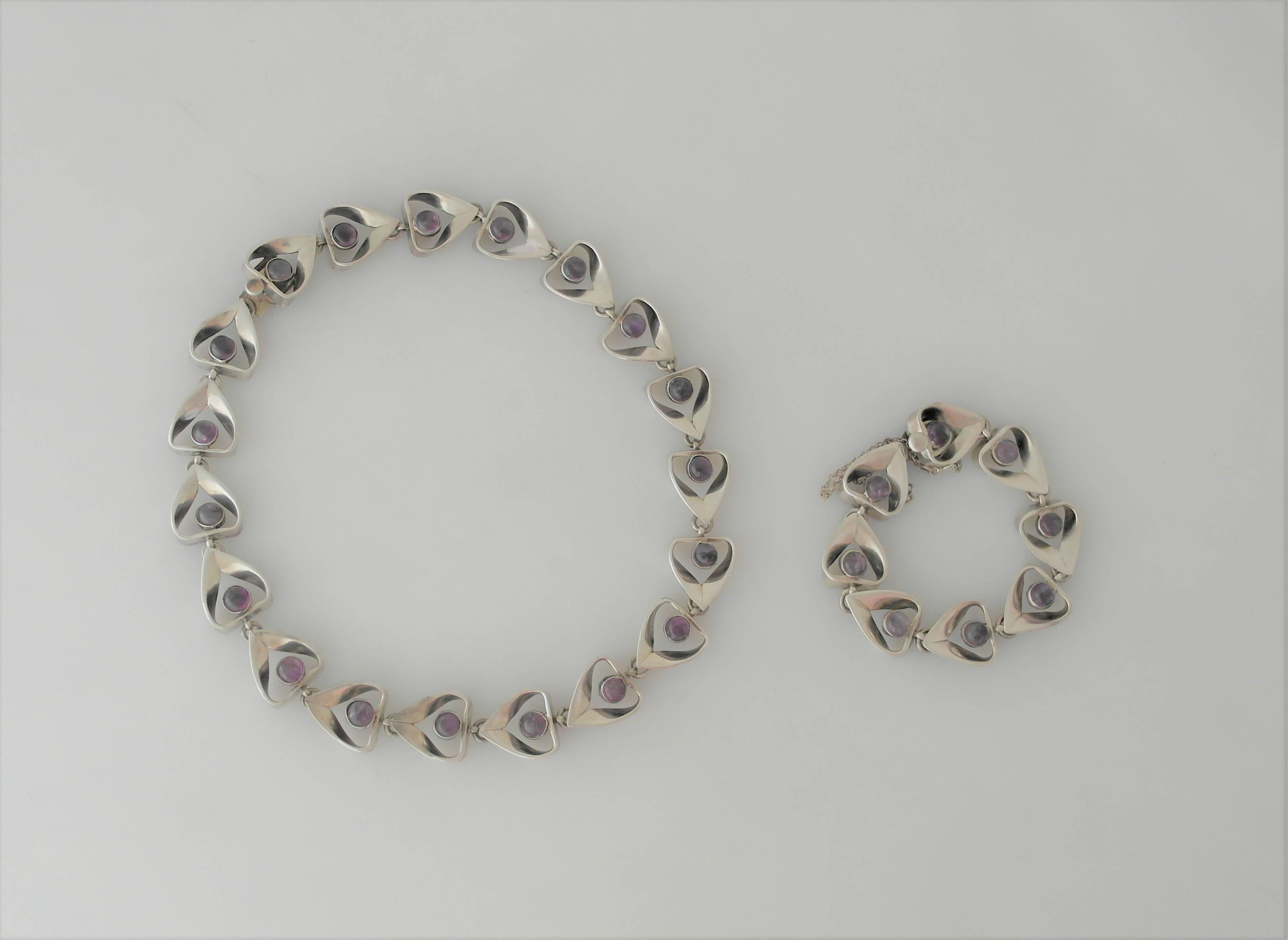 Being offered are a necklace and bracelet set by Emma Melendez of Taxco, Mexico.