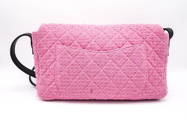 Rare one of a kind Chanel pink tweed crossbody bag with pink interior is a seasonal item in excellent condition. This can be worn crossbody or with the straps shorten, it can be worn on the shoulders. Leather straps are adjustable and do not show