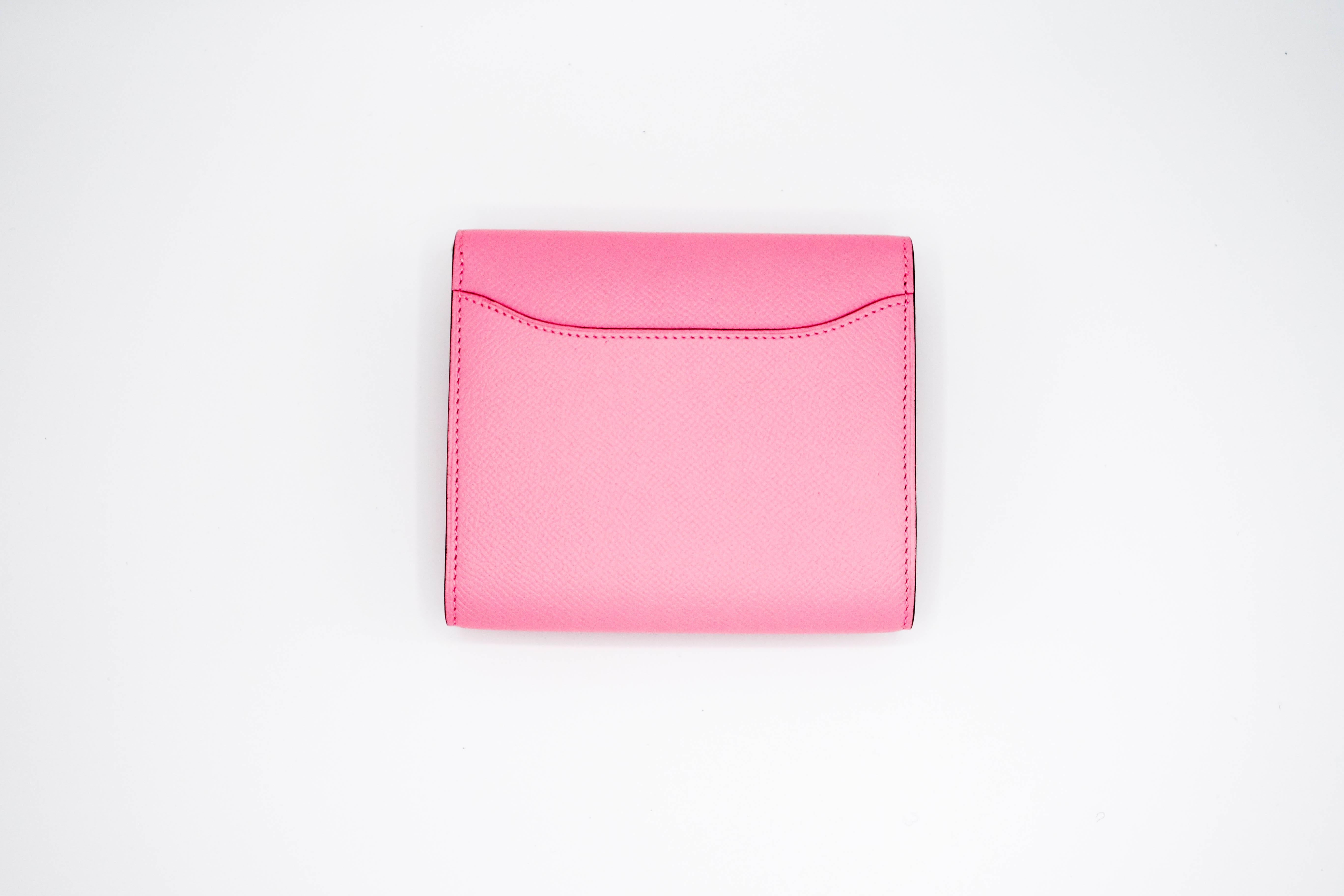 Rare, beautiful, store-fresh Hermes Constance compact wallet in Rose Confetti Epsom leather with palladium hardware. The wallet features pink stitching, the iconic "H" snap lock closure, and a rear exterior pocket. 

This item is NEW and