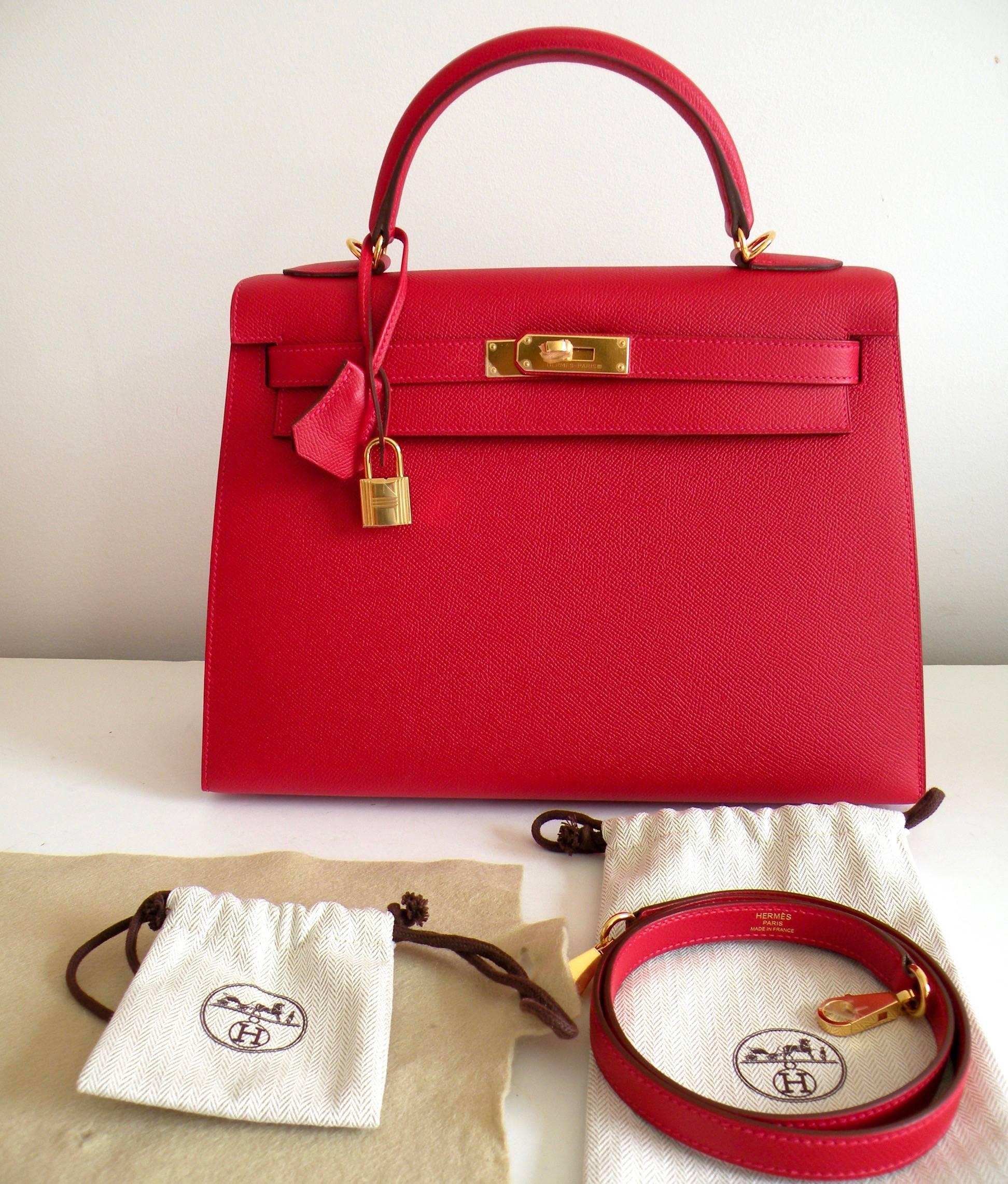 Hermès
32cm Kelly Bag
Most coveted Sellier (Rigid) Style 

Color: Rouge Casaque Red
Leather: Epsom

Hardware: Gold

Lined in Chevre

X stamp 
New never carried, plastic on the hardware

Shoulder strap for easy cross body hands free shopping

As