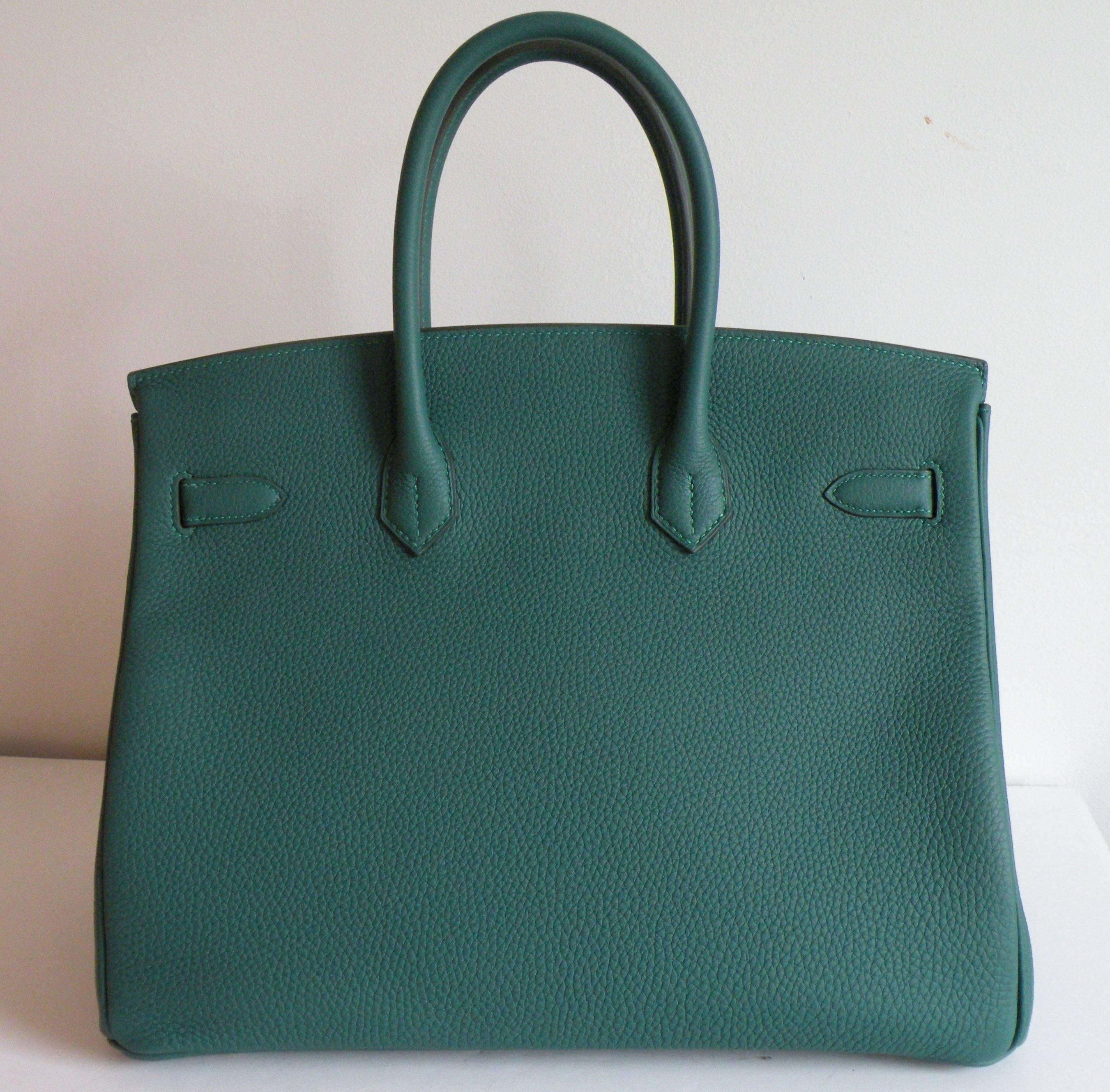 Hermes 35cm Birkin Bag 
The 35cm Birkin is Iconic
The name of the color is Malachite, a deep Emerald Green.
Done in Togo Leather and set with Gold Hardware
Amazing Combination
Brand New never carried
Plastic on the Hardware
Ready for gift