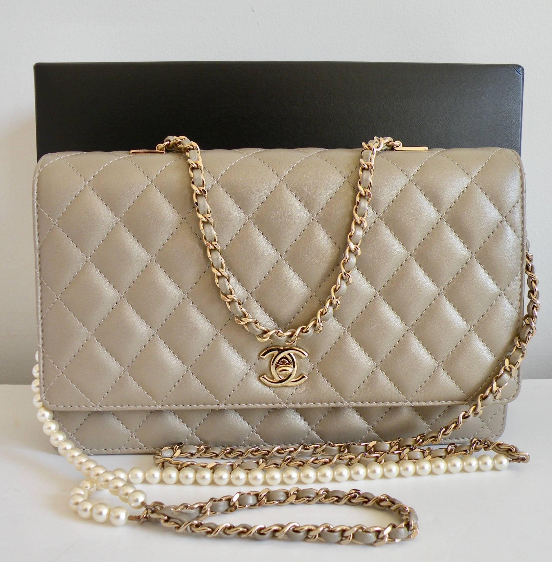 CHANEL

Flap Bag

Gold Lambskin

Fantasy Pearls
Such a pretty, elegant handbag

Light Gold Metal

Removable Pearl Chain so you can use as a shoulder, a clutch, or a hand carry with short chain

Lambskin

Color: Gold

Size: 5.9 x 9.8 x 3.1 inches

15