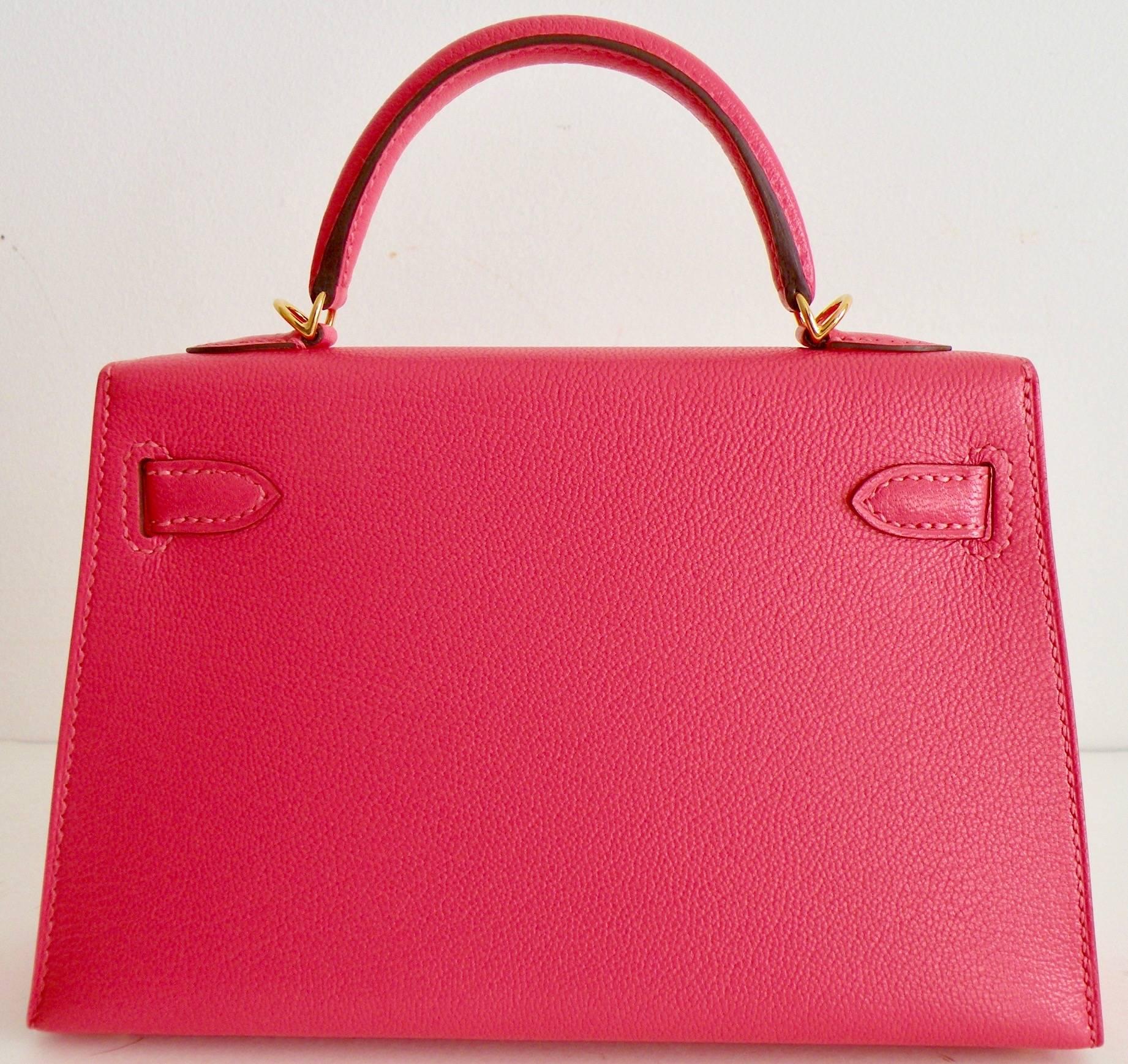 Hermes Mini Kelly Bag 
Size: 20cm
Color: Rose Lipstick
Leather: Chevre
Hardware: Gold

Hermes Kelly Bag done in 20cm, a new size and shape just introduced from Hermes. It quickly sold out to their VIP clients!
Very Rare, a Collectors Item!
RARE