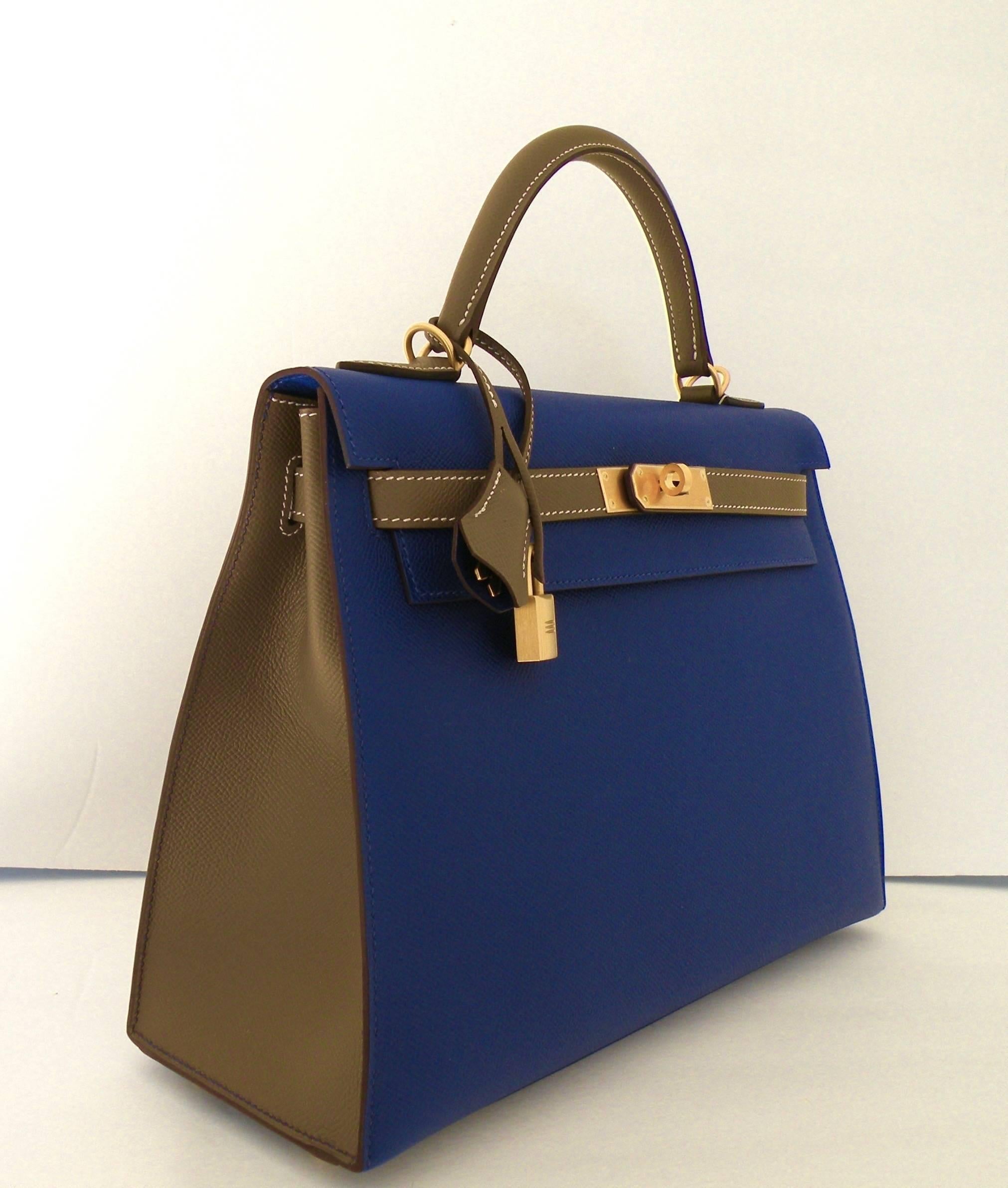 Hermes 32cm Kelly in Sellier Style
HSS
Specially ordered , marked with a Horseshoe stamp
Lovely Combination
Blue Electric and Etoupe
Epsom Leather
Brushed Gold Hardware
Blue Electric on Front , Back, Bottom and Inside
Etoupe on Handle,  Straps and