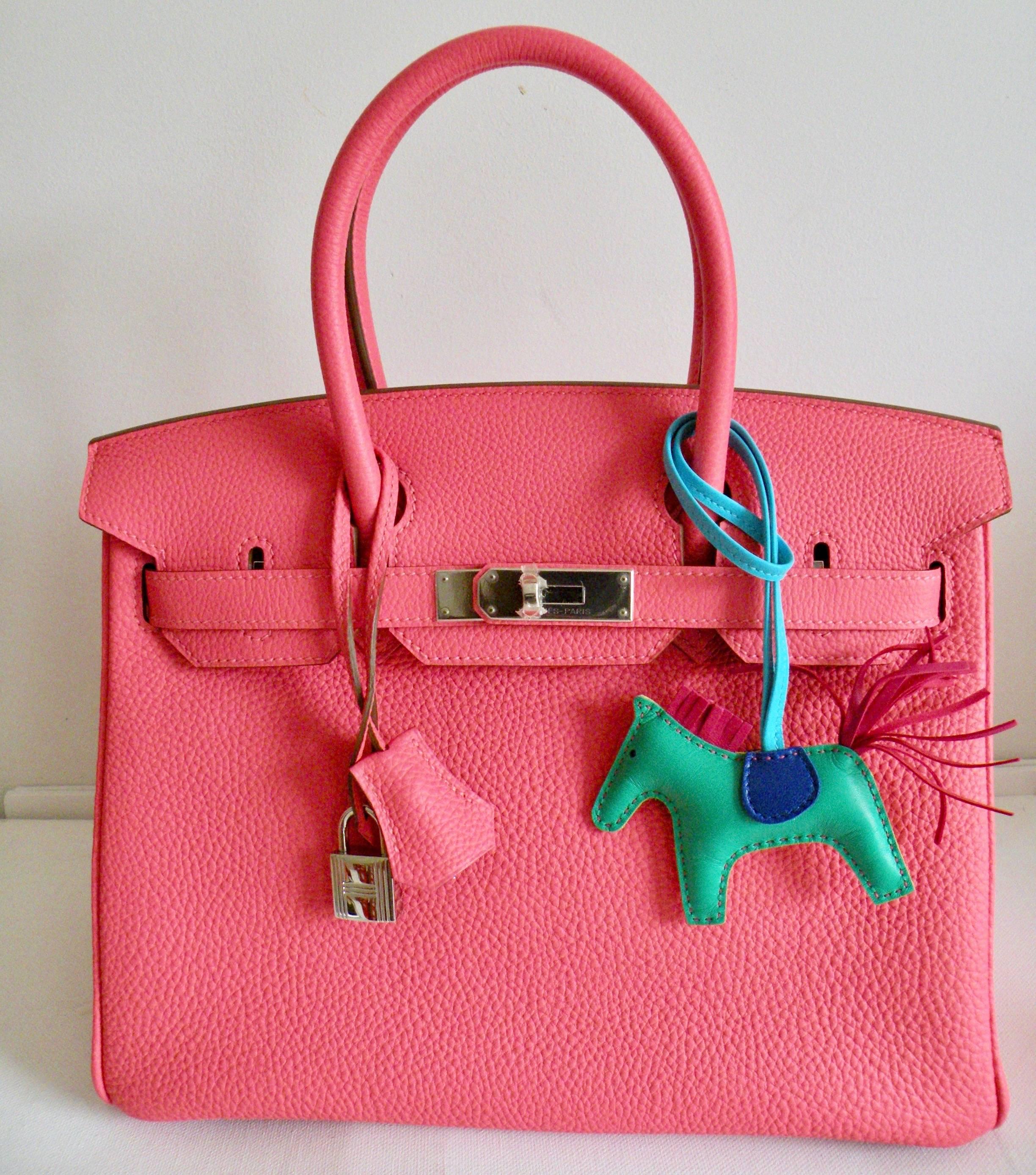 Hermès Birkin Bag in Rose Lipstick
Rare find! 
This is one of the most sought after colors, and one of the rarest to find.
Perfect color for spring.
You will be sure to turn heads when wearing this color Birkin.
The Rodeo horse shown in one of the