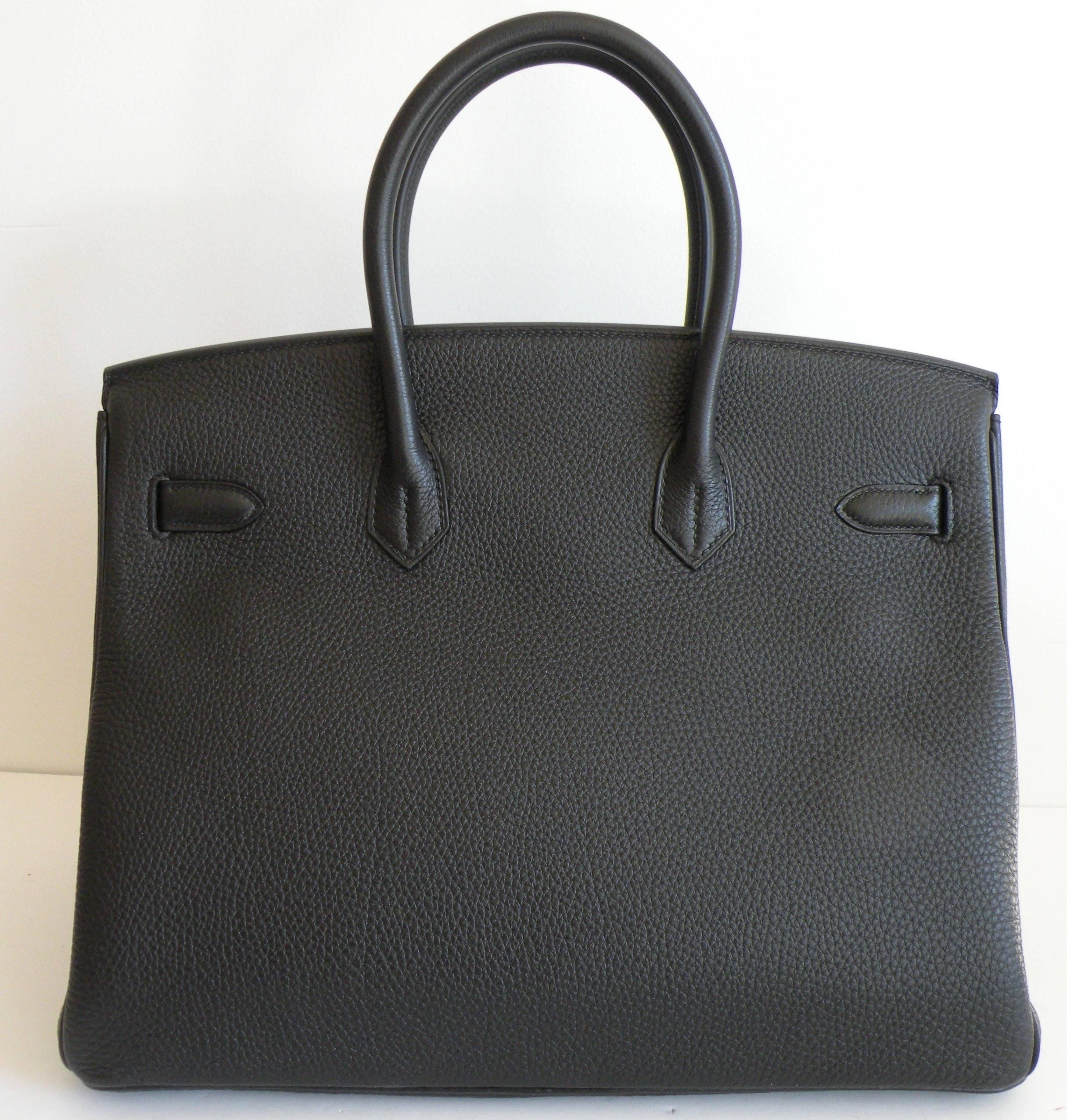 Hermes 35cm Birkin in Black Togo Leather with Palladium Silver Hardware
Togo Leather , the most durable leather.
Such a classic bag.
Black set with Palladium is a stunning combination.
The shape on this bag is gorgeous!
Plastic on the hardware,