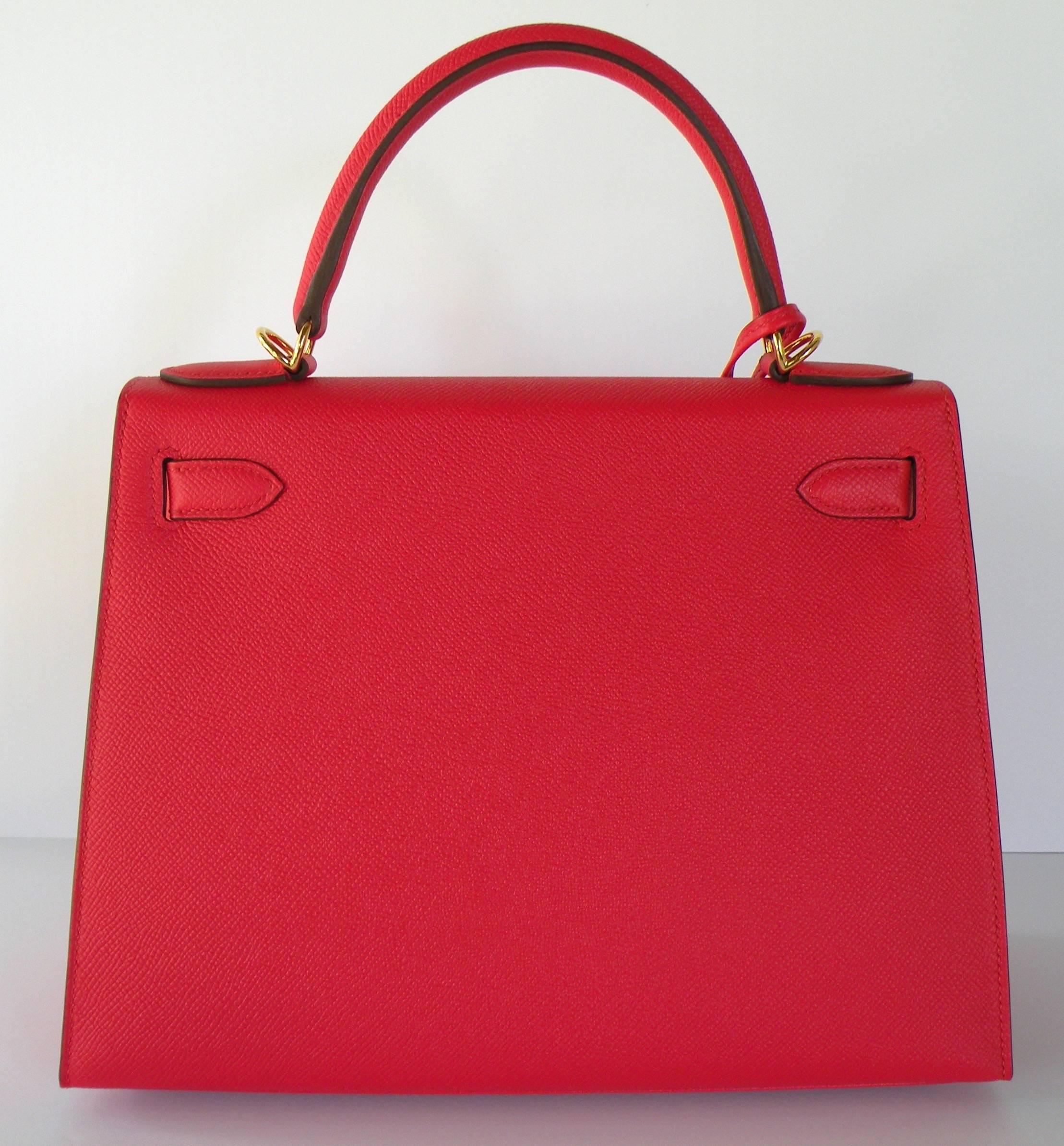 Hermes Rouge Tomate Sellier Kelly 28cm 
Epsom leather with gold hardware.
Sellier style which means stitching outside.
This color is a regal red. just stunning.
Tonal Stitching
Toggle Closure
Removable shoulder strap
Lock and Keys
Clochette


The