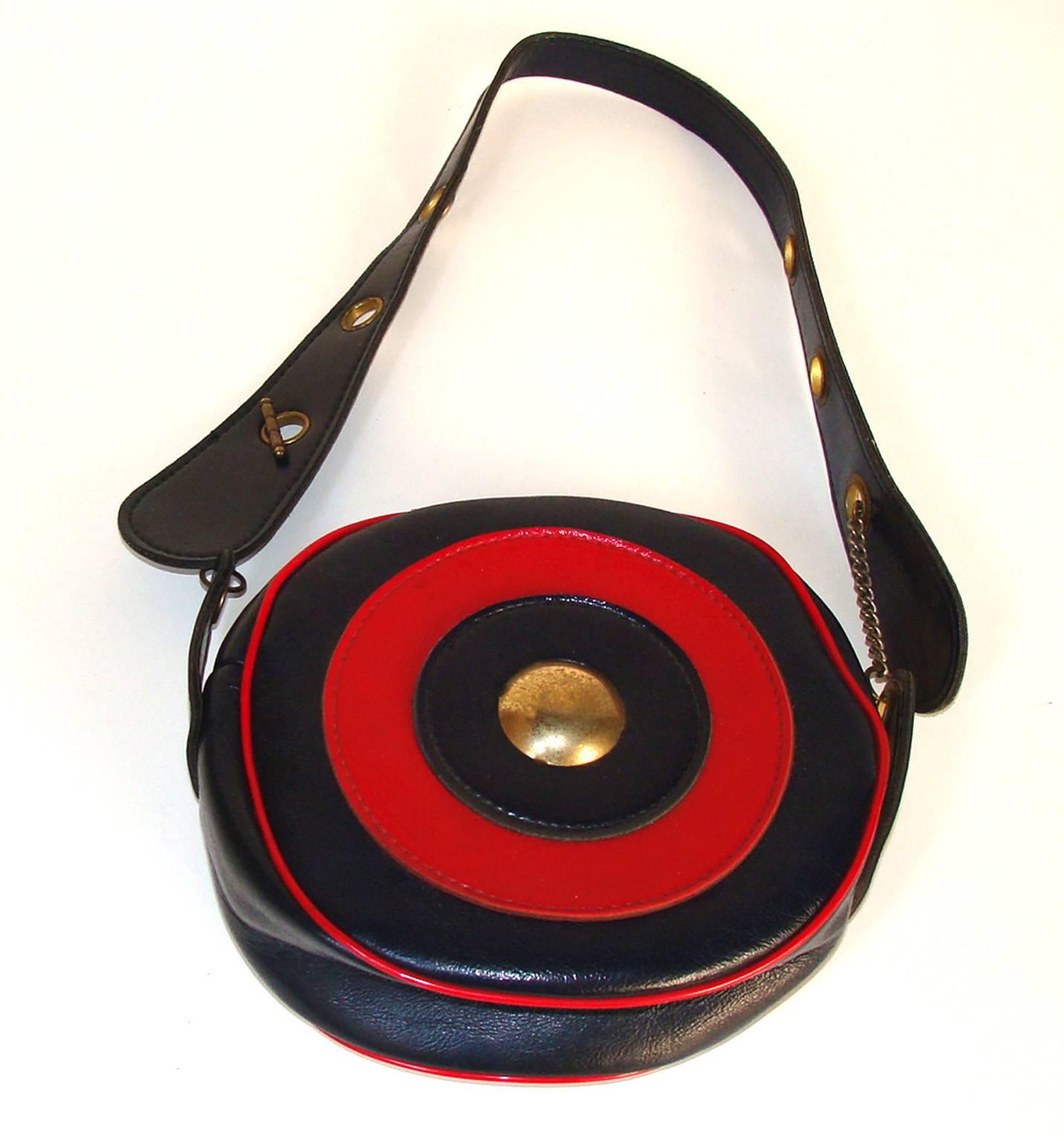 This is great and rare example of 1960's fashion.  A long-time picker brought this to our shop and was not sure we would accept it because it is made of vinyl, not leather.  Well vinyl was the new leather in the 60's and some great fashion bags were