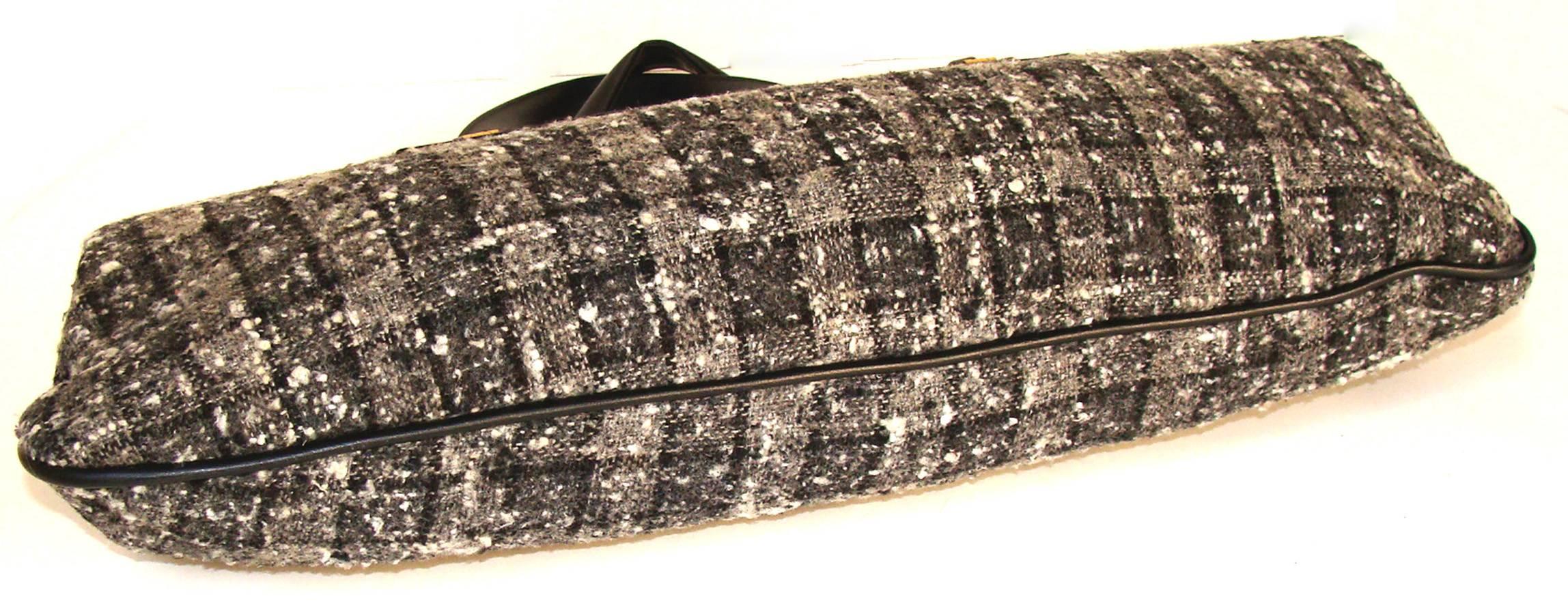 This capacious tweed bag is exquisite with black, winter white and gray.  Or, wear it with jeans and a cashmere sweater.   Lift an outfit to chic with just the change of a handbag.   If you are 5 feet 10 or 5 feet 4, you will stand out with this 20