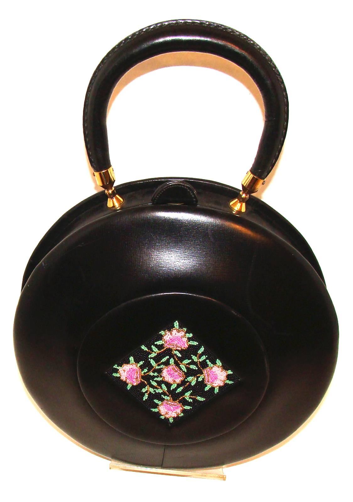 This rare  bag was consigned by a long-time customer who is paring down her collection as she downsizes.  (We have several of these customers who have collected and purchased from us since the late 1980's and are now beginning to downsize.)   It is