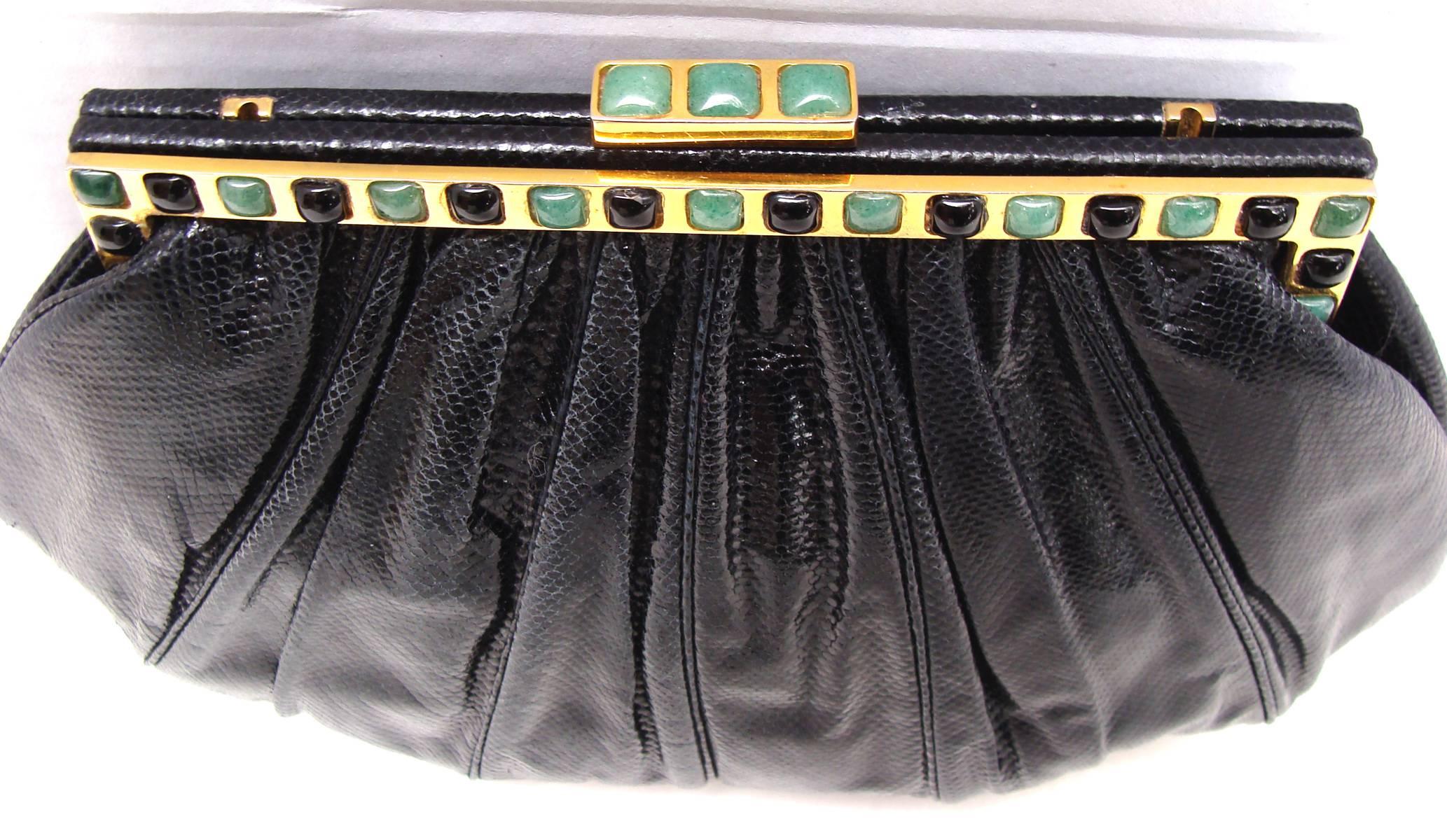 This is a timeless classic Judith Leiber evening bag in black karung with what appears to be jade and onyx style stones inlaid into the frame and clasp.  

The genuine karung exterior has a ruched effect with six vertical panels on the front and