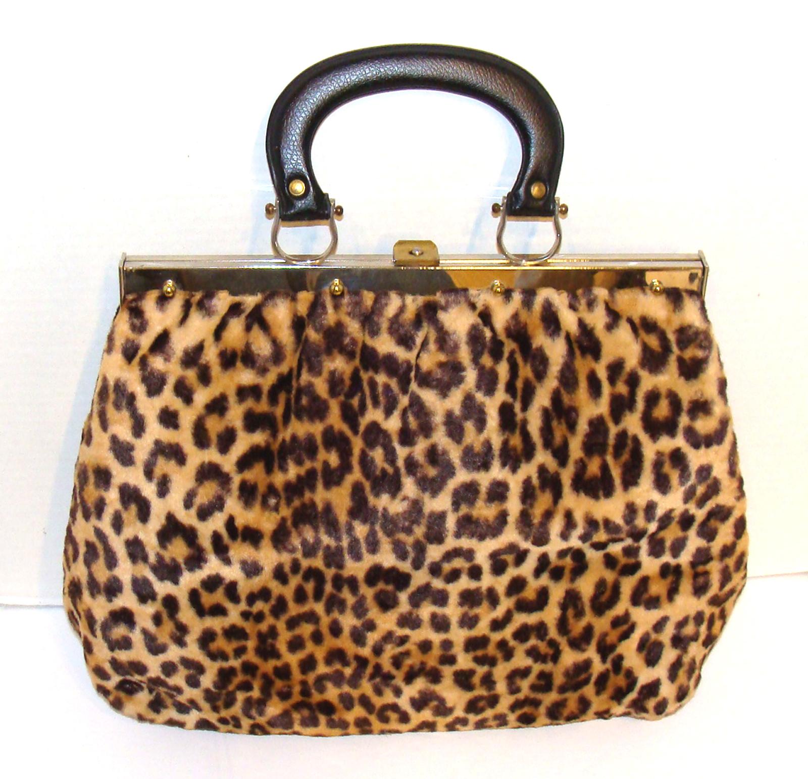 This satchel is one of our favorite faux leopard bags from the 1960's.  

The size is practical & the form is wonderful.  Practical & chic is a great combo.  You can carry an iPad & everything you need fits in this great purse (my laptop fits,
