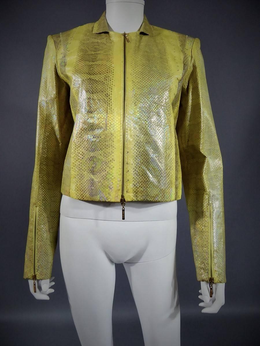 Circa 1990.

Italie.

Pair of trousers in pale yellow python by Roberto Cavalli. Soft python material covered with a thin layer of varnish with shiny bronze reflections. Pants embroidered with silver and gold sequins on the sides. Closure on the