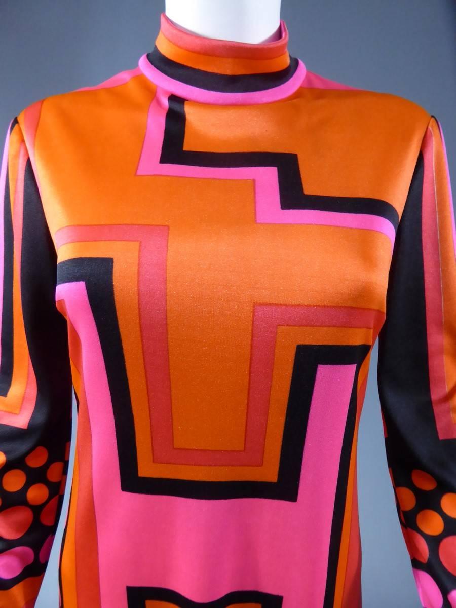 Circa 1970

France Dress

Jeanne Lanvin POP ART dress in silk and cotton. Very graphic patterns from the 1970's in pink and orange tones on a black background. Long sleeves and turtleneck collar. Dress closes in the back with a zip top