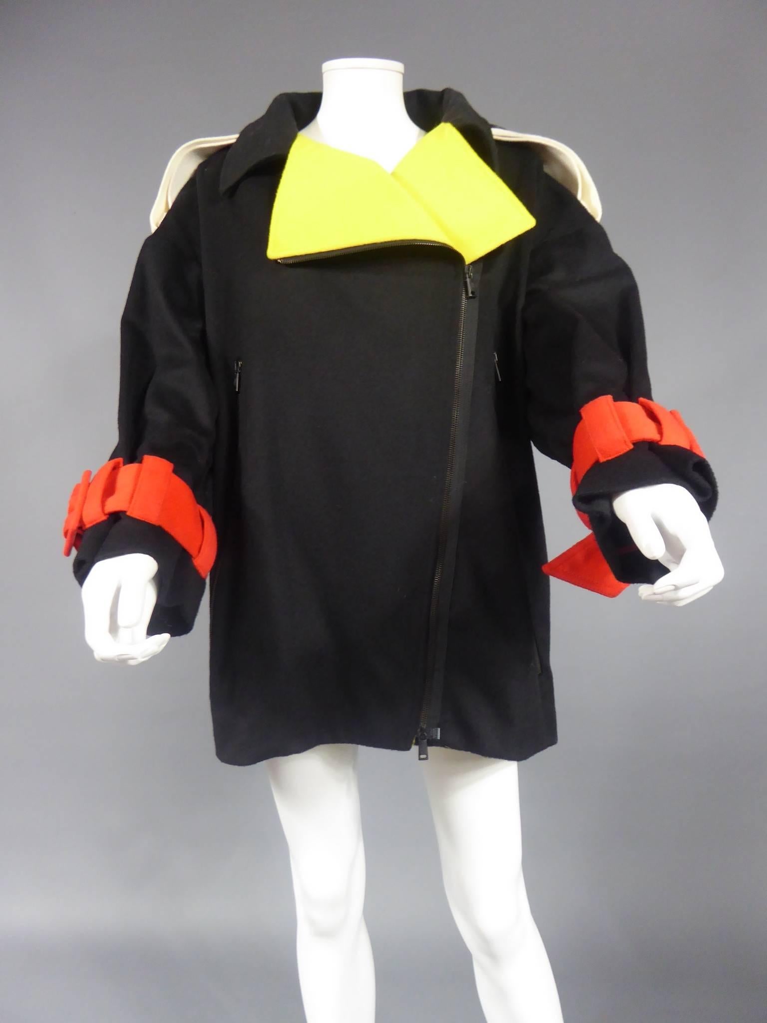 Circa 1980/1990

France

Beautiful coat from the Disney collection that is emblematic of the ready-to-wear collections of the playful couturier, Jean-Charles de Castelbajac. Thick black wool felt featuring over-sized codes from the Walt Disney