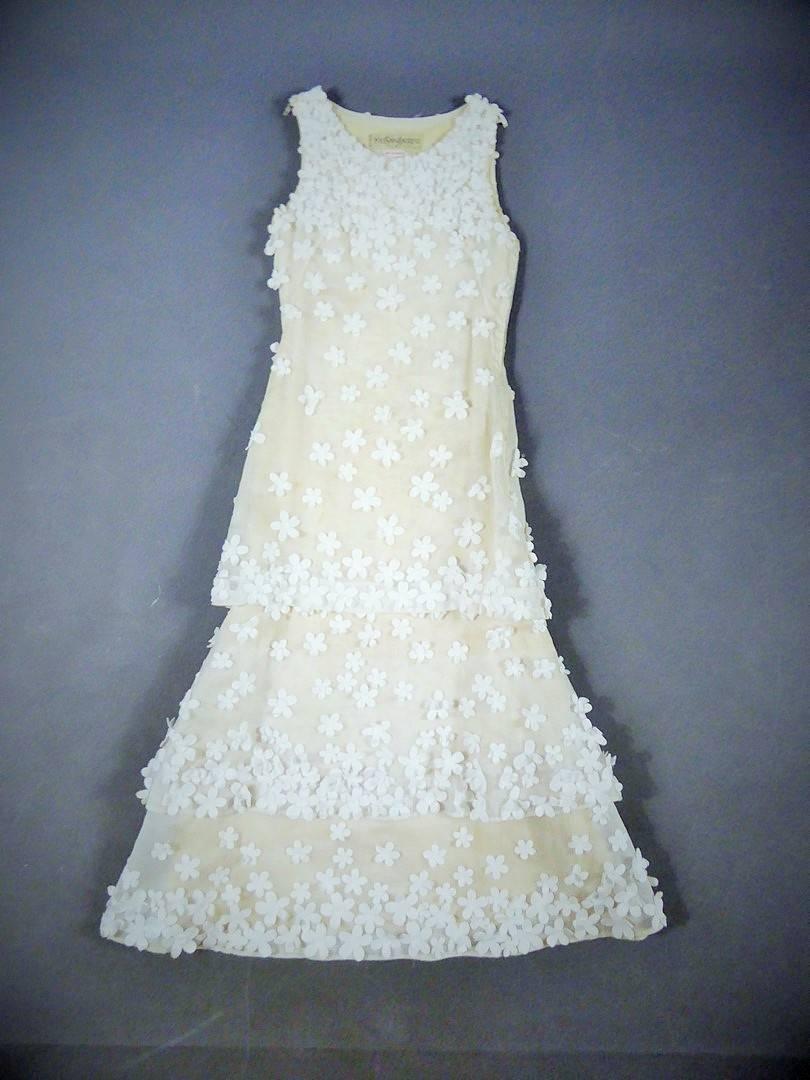 France Paris

Spring-Summer 1970

A ceremony or ball- gown in white organdy from the Spring Summer 1970 collection numbered 24277. Shades of pristine white scattered with randomly embroidered cotton daisies, evokes the freshness of the fields and