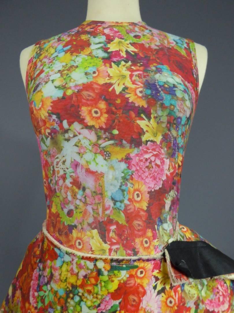 France Japan

Summer 2004

A body and a ball skirt ensemble in flowery printing dating from Summer 2004. Digital printing designed from collages of photos representing natural flowers and jewellery in a strong polychromy and saturated colors. The