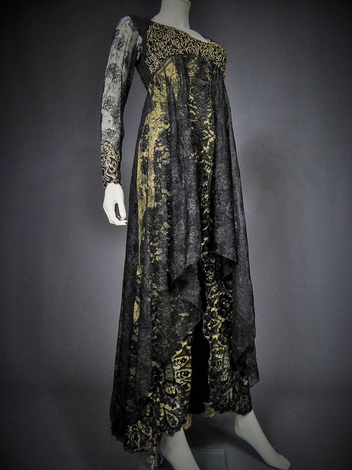 Circa 1988 - 1992

France

Evening dress Christian Lacroix Haute Couture from the beginning of the chic gothic movement dating back to the end of the 80s. Cream tulle background embroidered with gold lurex flowers and black calais lace on the dress.