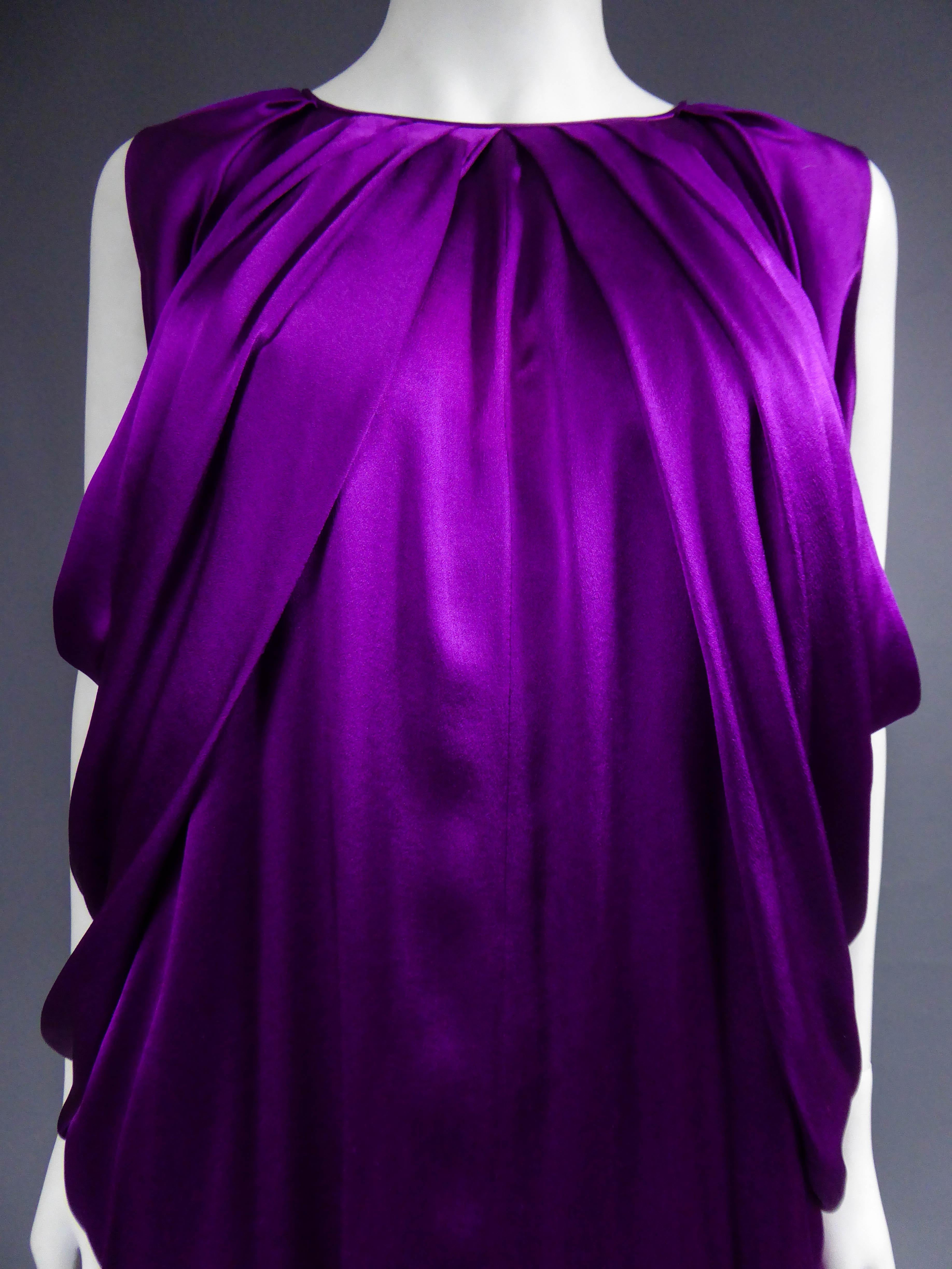 Spring Summer 2008 Collection
France

Yves Saint Laurent sleeveless dress in amethyst silk satin. Spring Summer 2008 collection by Stéfano Pilati. Variation passage no. 14. Round neckline underlined by flat pleats with draping effect all along the