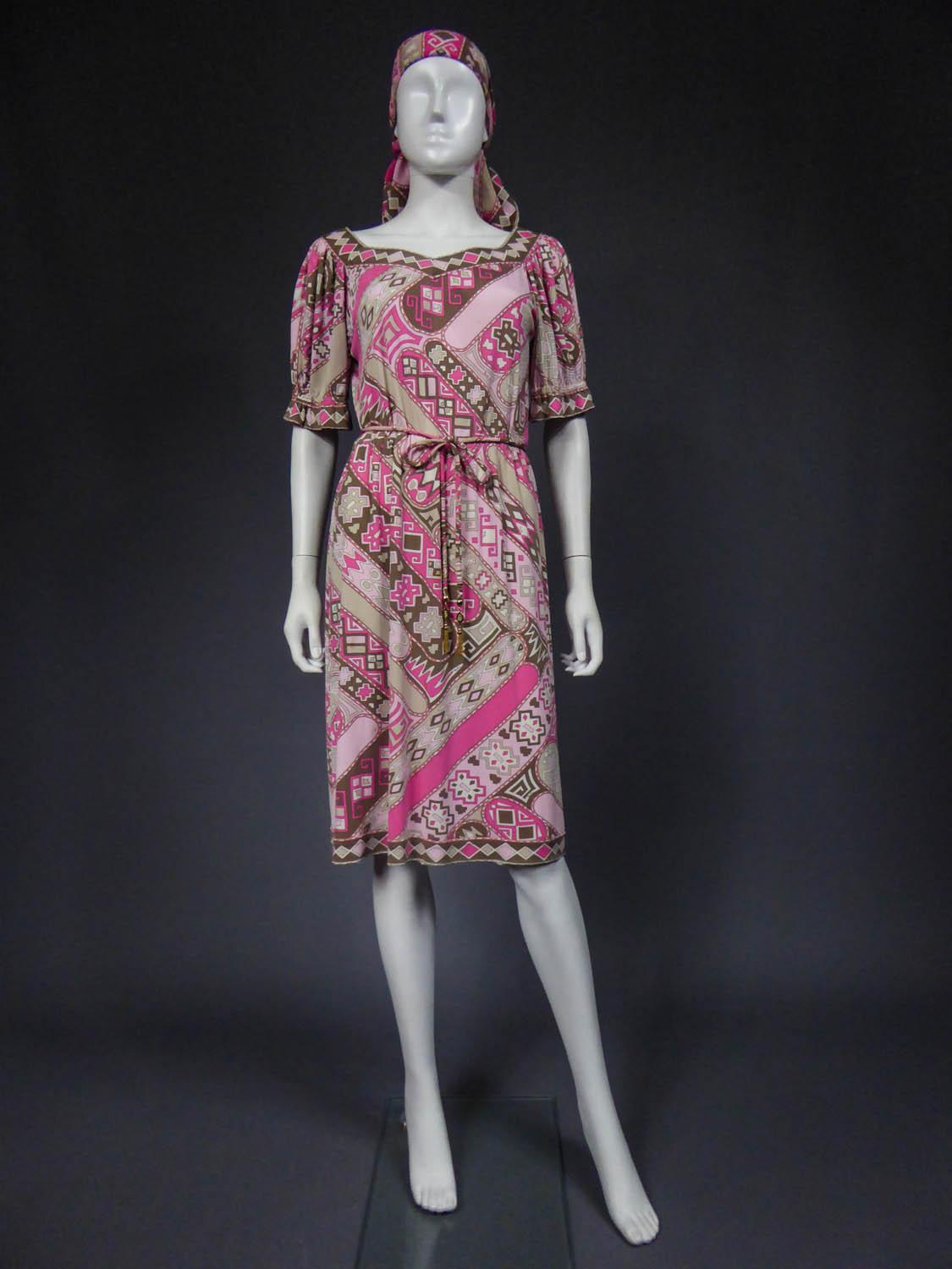 Circa 1970
Italy

Emilio Pucci summer dress in printed silk jersey with psychedelic patterns in shades of pink, light pink, white, beige and brown dating from the end of the 1960s. Dress tightened at the waist and accompanied by a matching