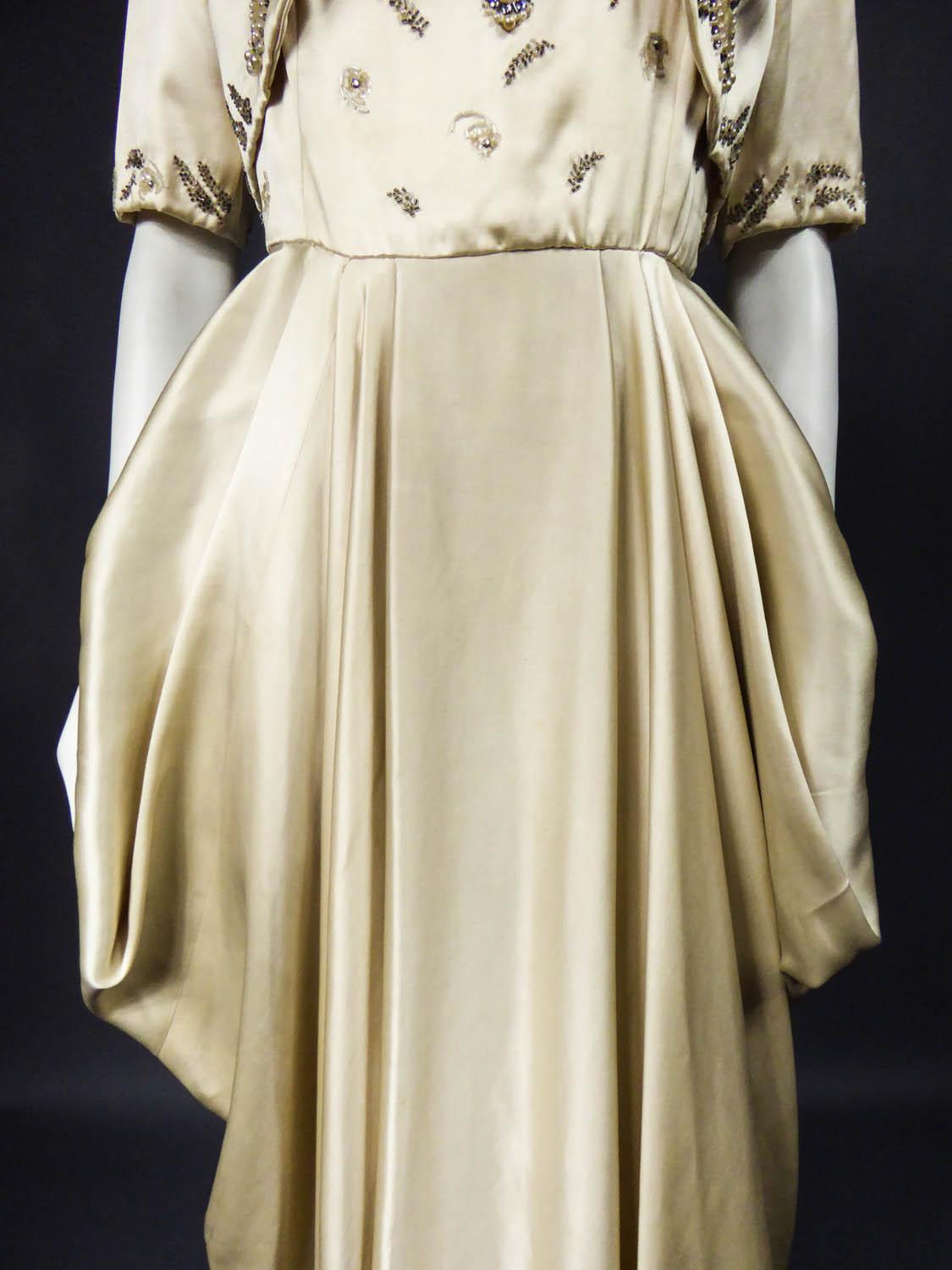 pierre balmain evening dress in pale pink satin and cream satin brocade with applied maple leaves