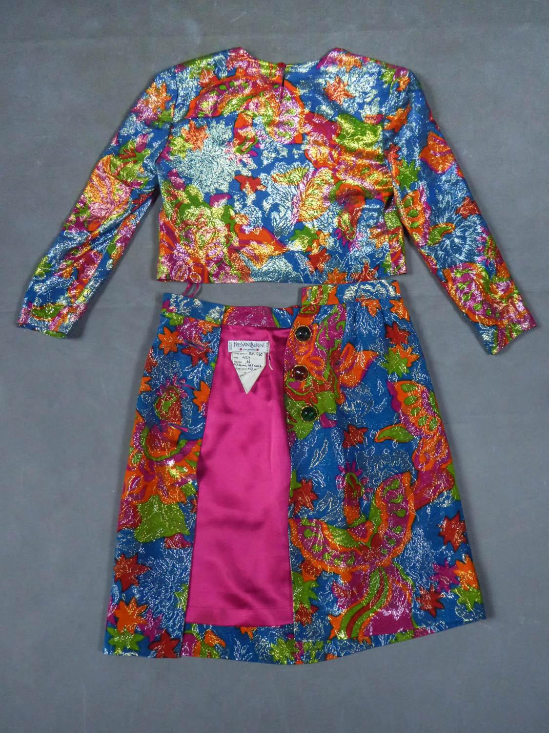 Circa 1987
France

Prototype of a two-piece set in blue, orange, green, fuchsia and silver lamé with floral patterns. Impressionist inspiration evident in reference to the Yves Saint Laurent Van Gogh Collection. Round neck and long-sleeved top