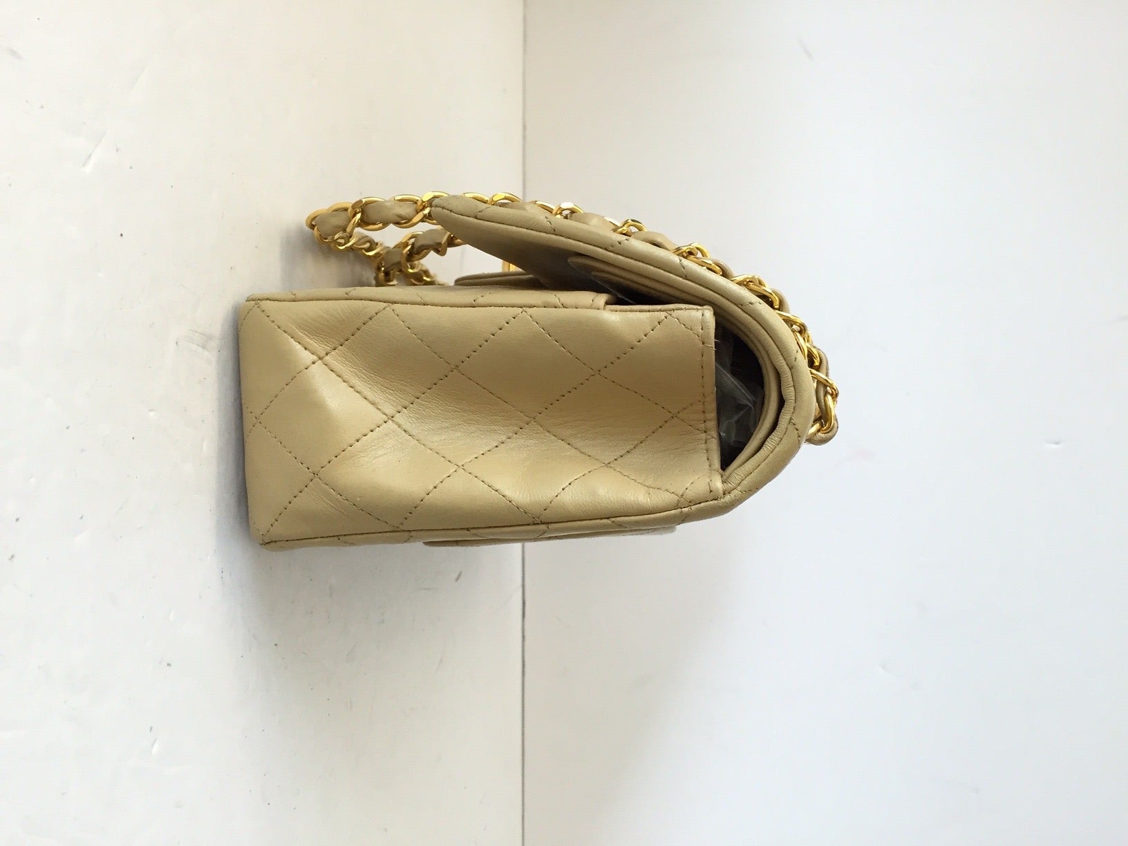 Brand: Chanel
Manufactured: France 
Color: Beige 
Size: Medium

Bag Length: 10