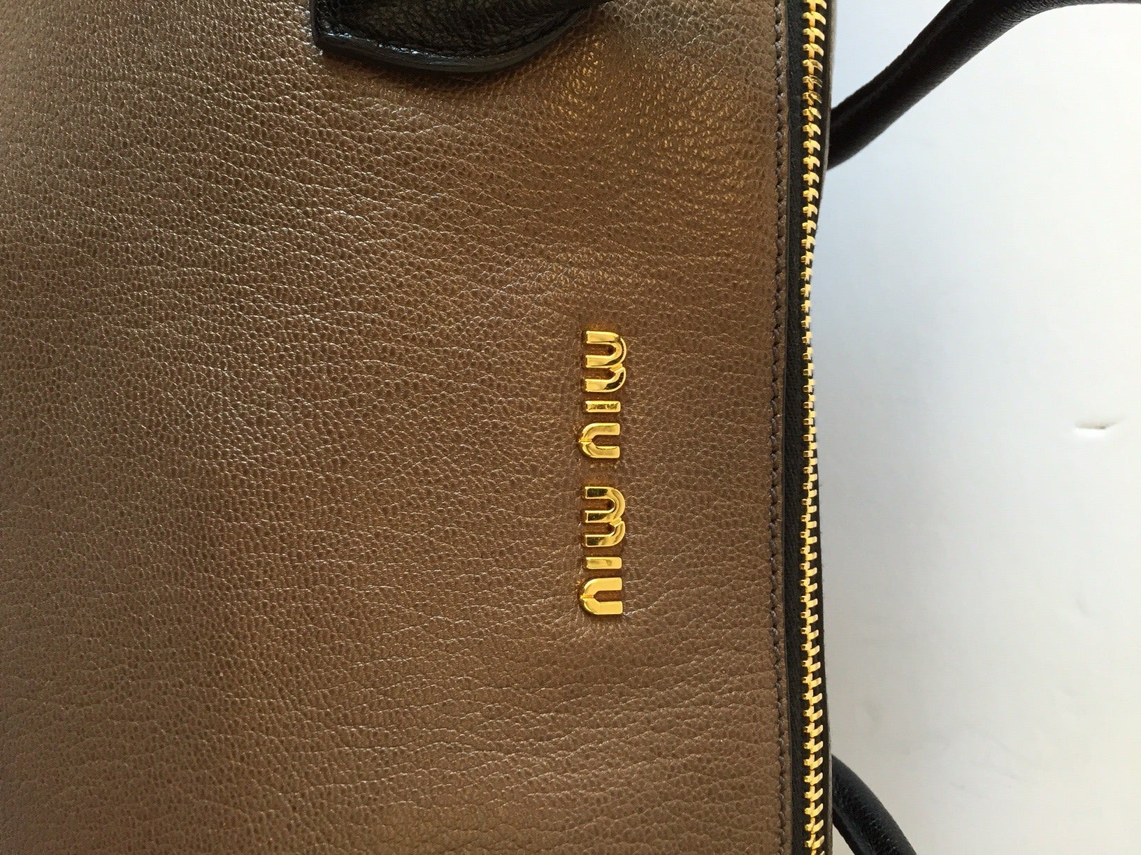 Brand: Miu Miu 
Manufactured: Turkey 
Color: Black and Brown 
Material: Leather 

Bag Length: 16.5