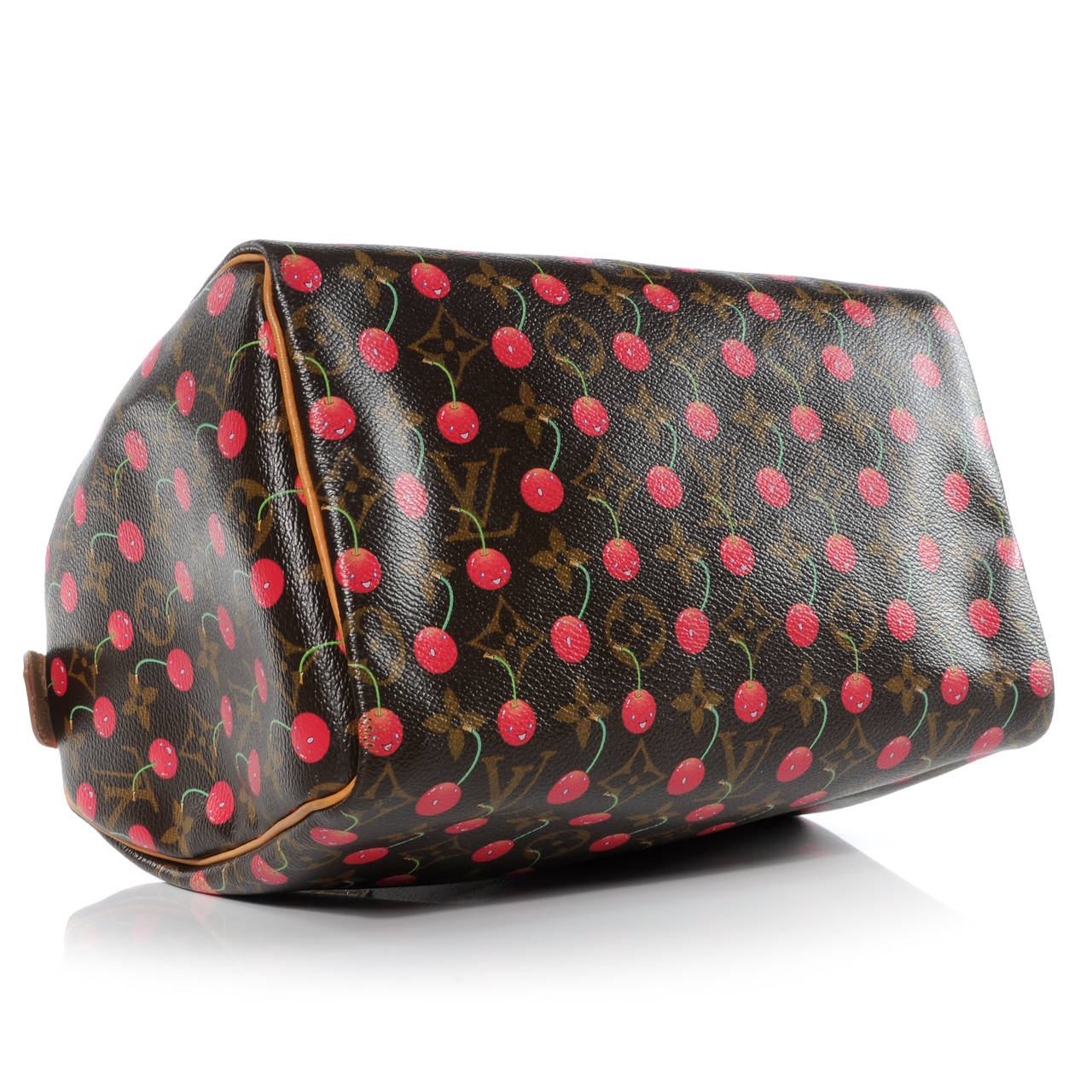 This is the authentic LOUIS VUITTON Cherry Cerises Speedy 25. This Speedy classic is composed of Louis Vuitton monogram on toile canvas, vachetta cowhide leather, polished brass hardware, and an applied print of smiling faced cherries. The top