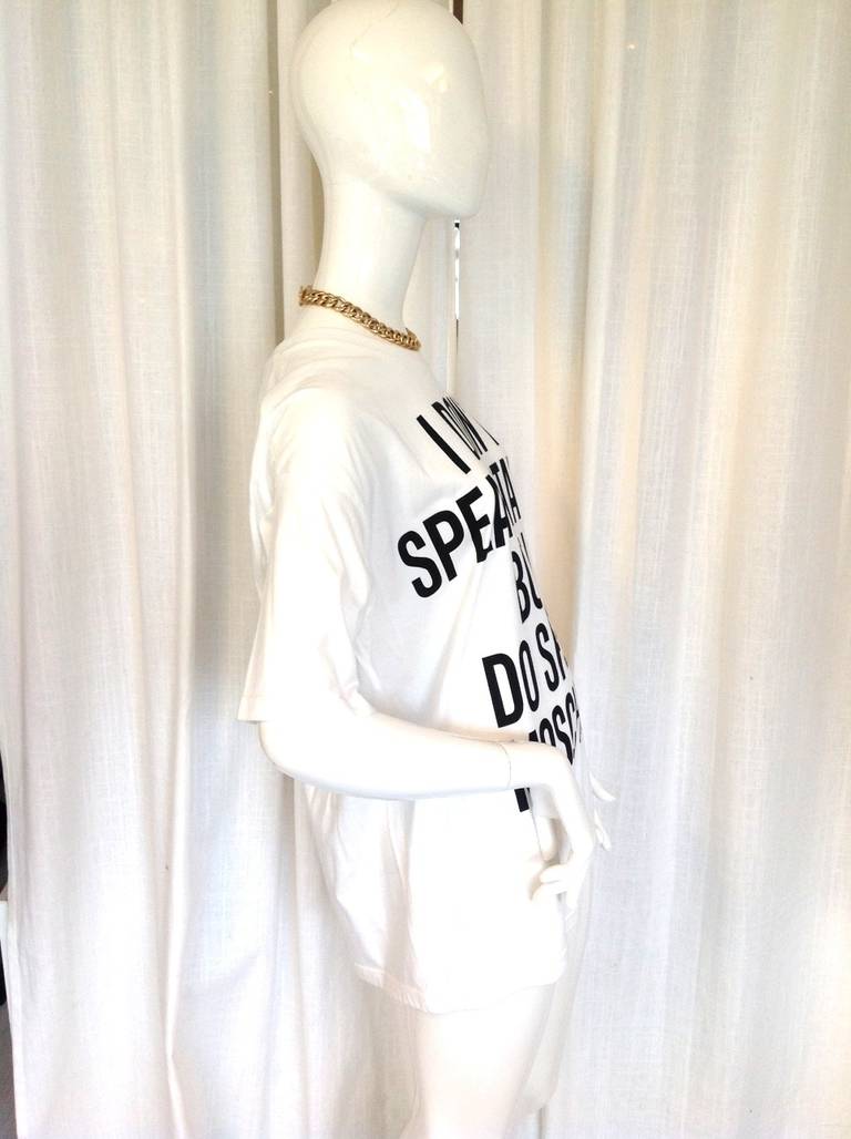 Completely brand new with the original tags still attached, never worn! This is a clever twist on language devised by the amazing contemporary brand Moschino!

Brand: Moschino
Made in: Italy
Colour: White and Black
Material: 100%