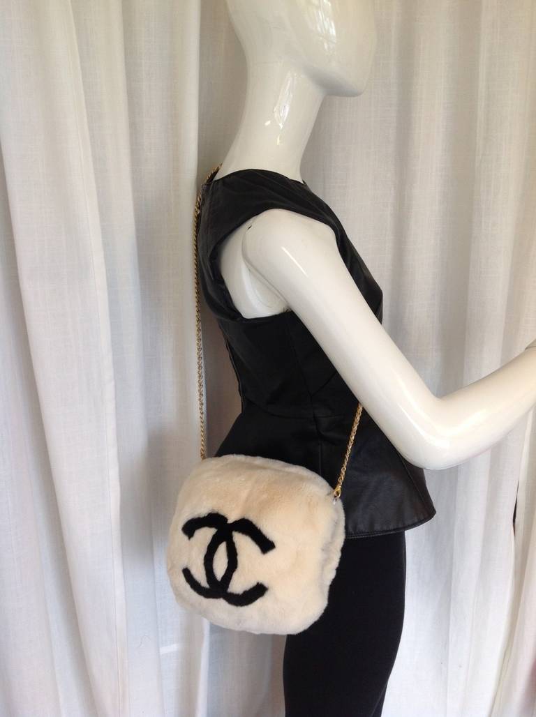 Brand: Chanel
Manufactured: France 
Color: White, Black  
Hardware Color: Gold 
Material: Rabbit Fur

Bag Length: 10