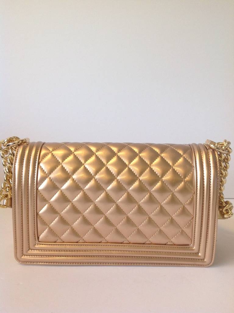 Brand: Chanel
Manufactured: Italy 
Color: Gold
Size: Medium

Bag Length: 10
