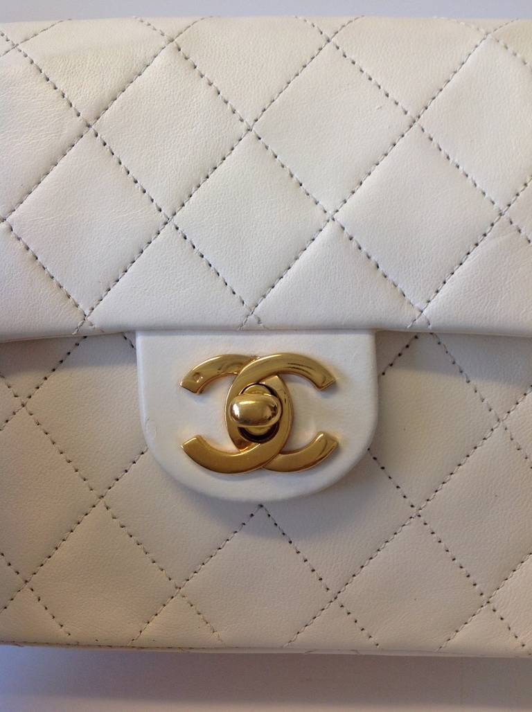 Brand: Chanel
Manufactured: France 
Color: White 
Size: Small
Year: 1987

Bag Length: 6.5