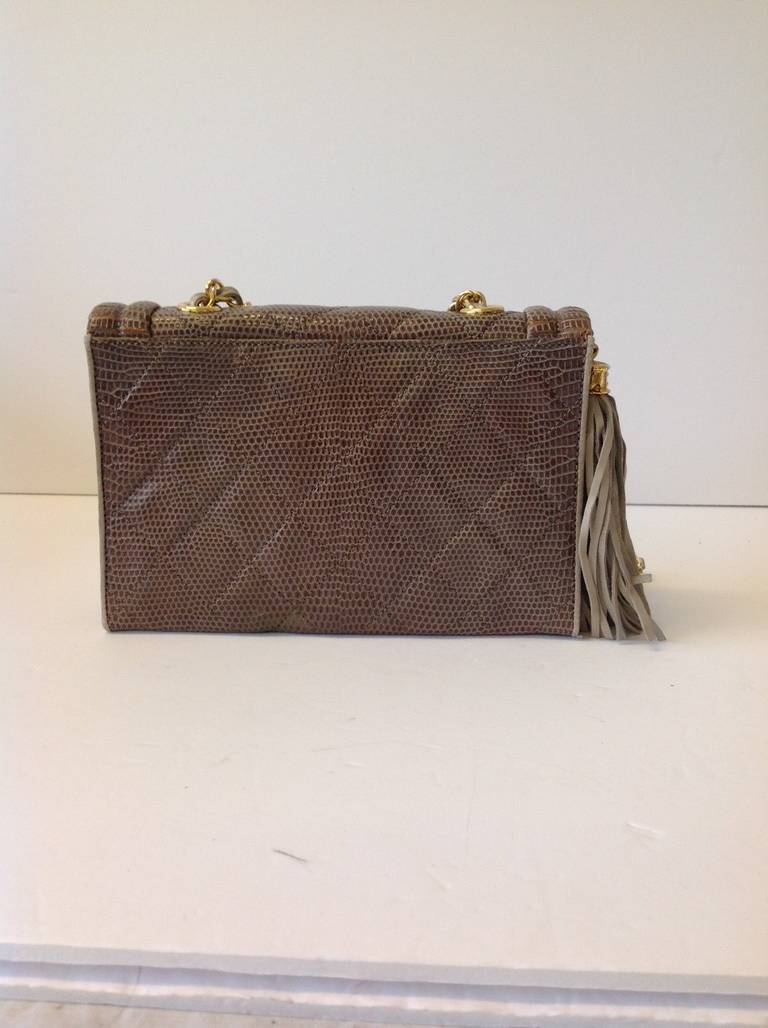 Brand: Chanel
Manufactured: Italy 
Color: Taupe 
Material: Lizard

Bag Length: 8