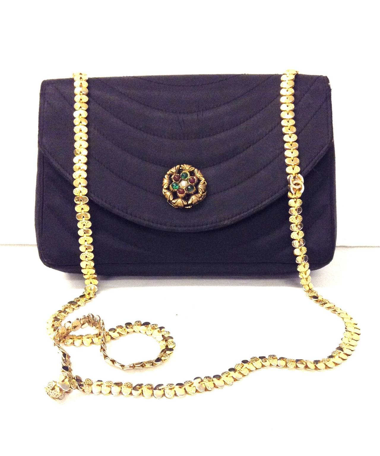 STUNNING to Die for Vintage Chanel flap bag with Gripoix Stone on front setting 

Minor Scratches on silk on the front of the bag 

comes with duster and authentication by My Poupette 

Size - Small - 5 inches in height - 7.5 inches in length 