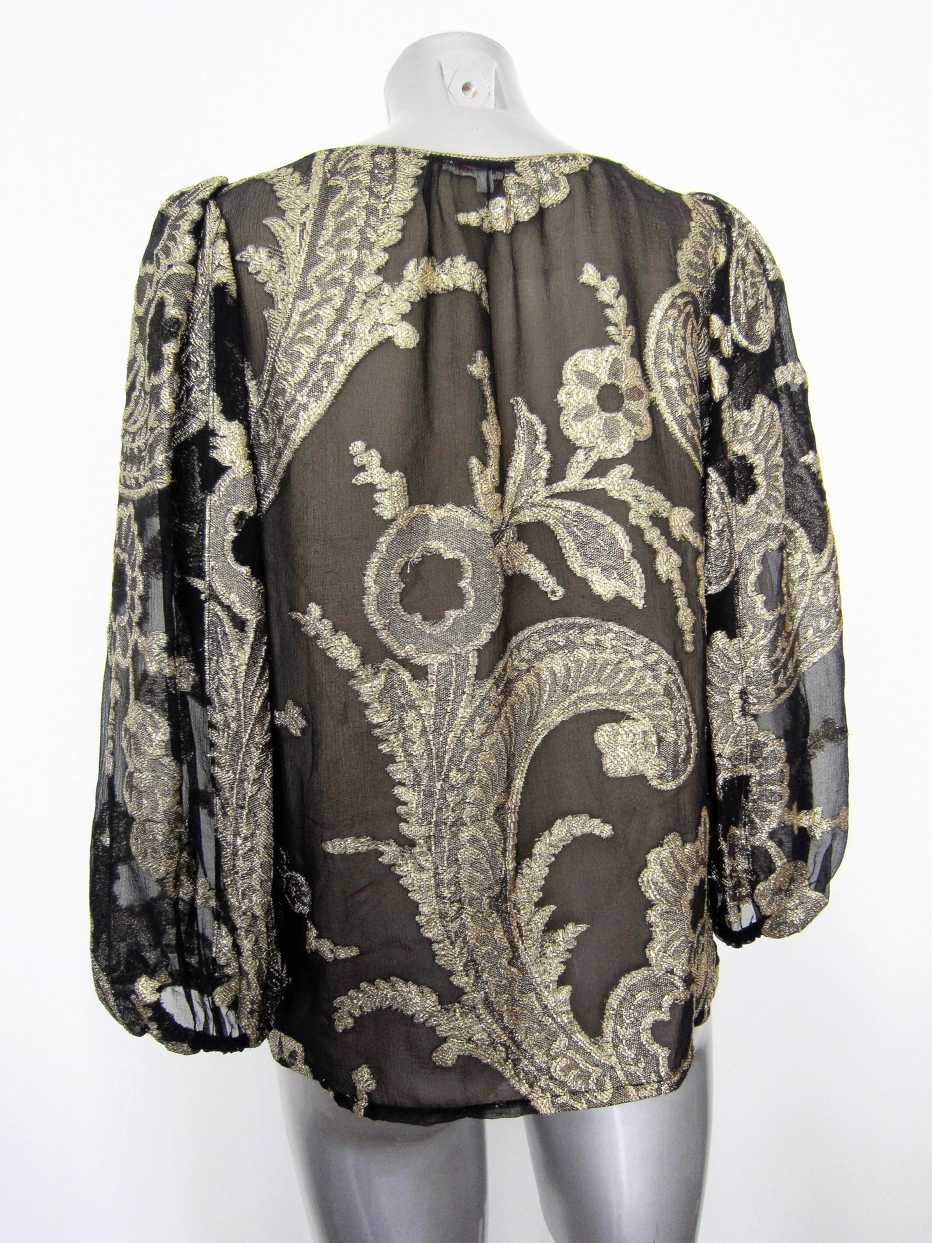 Collectible Yves Saint Laurent black silk muslin blouse with gold flowers lurex patterns, 1976 Russian Collection

Size: 34 fr, 38 it, 6 UK, 2 US But it wear a 40-42 It

Condition: Good Conditions, Some light signs of wear

Approx. Measurements:

-