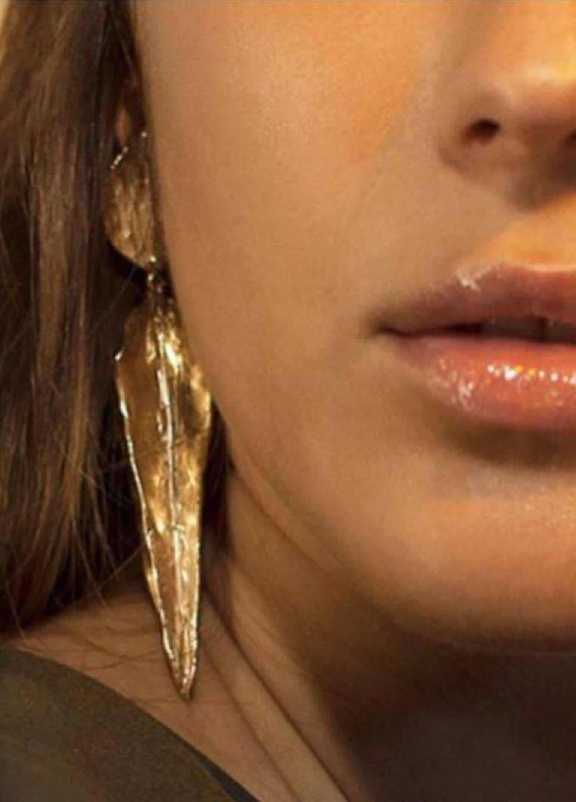 Giulia Barela Arizona Long Gold Plated Bronze Earrings, dipped in 24k gold plated bronze

The composition, surface and attention to detail is what makes these jewels enchanting. Giulia Barela's creativity derives from her eye for traditional fabrics