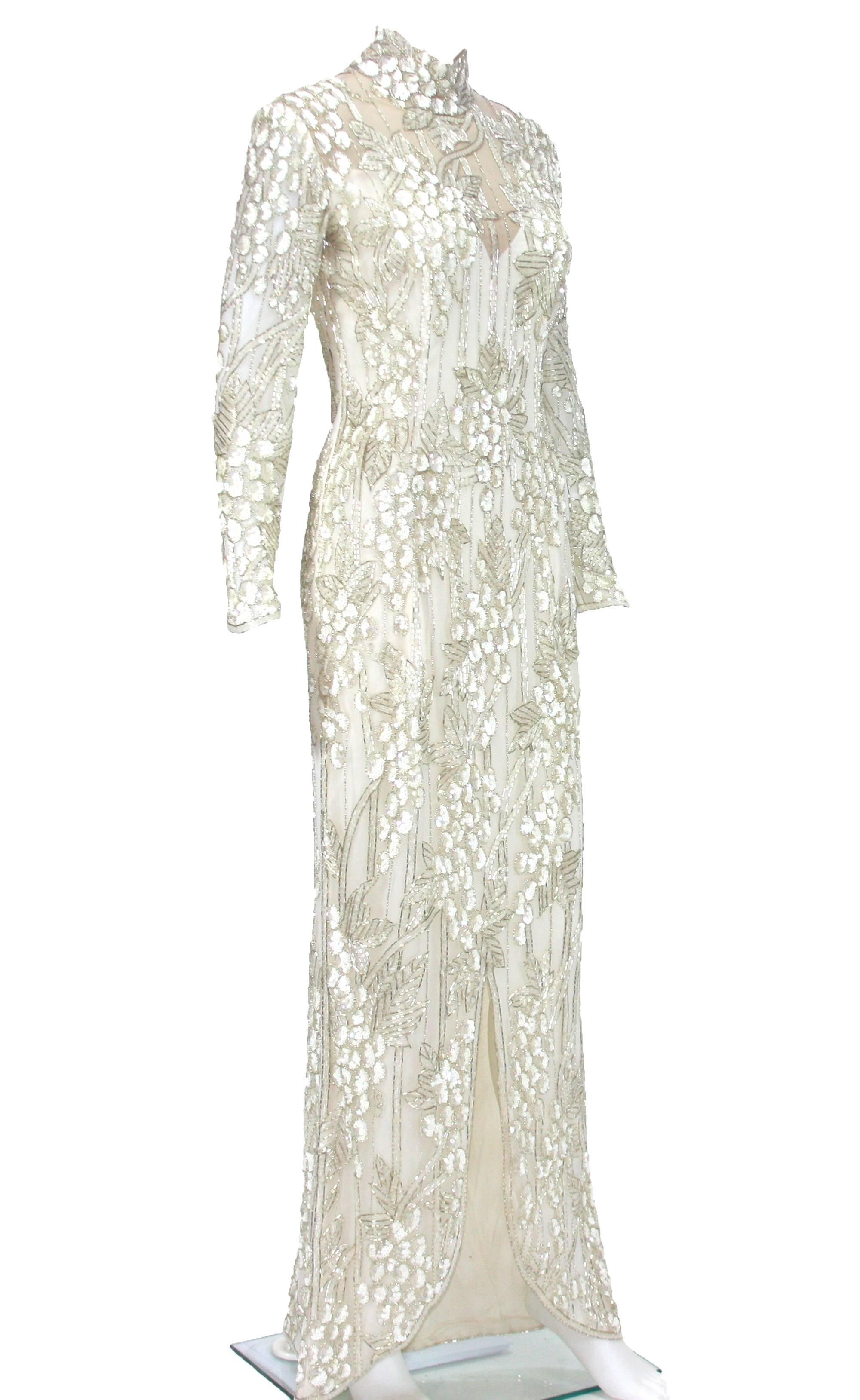 The same dress in gold color was worn by Sharon Stone in the 1995 film  Casino.
A white embroidered net gown with a beaded grapevine design, from the California Collection - a salute to the Napa Valley.
Sold at Christie's for $13,200.
Fully lined.