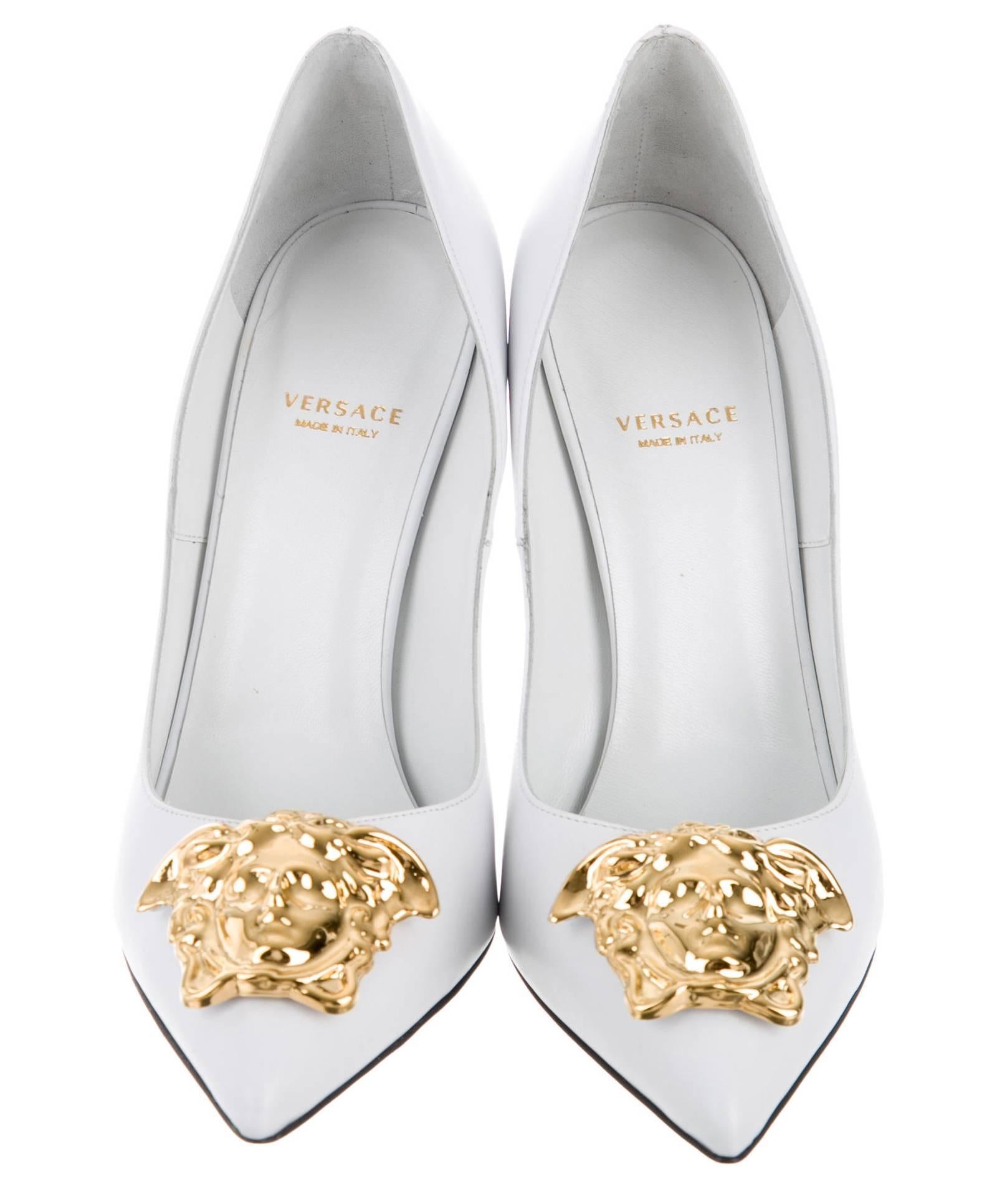 White leather Medusa pumps from Versace featuring a pointed toe, a branded insole and a gold-tone high stiletto heel.
Gold-tone Medusa embellishment at tops.
Italian Size - 38.5
Heel - 4.5 inches (11.5 cm).
Lining Composition:  Leather 100%
Outer