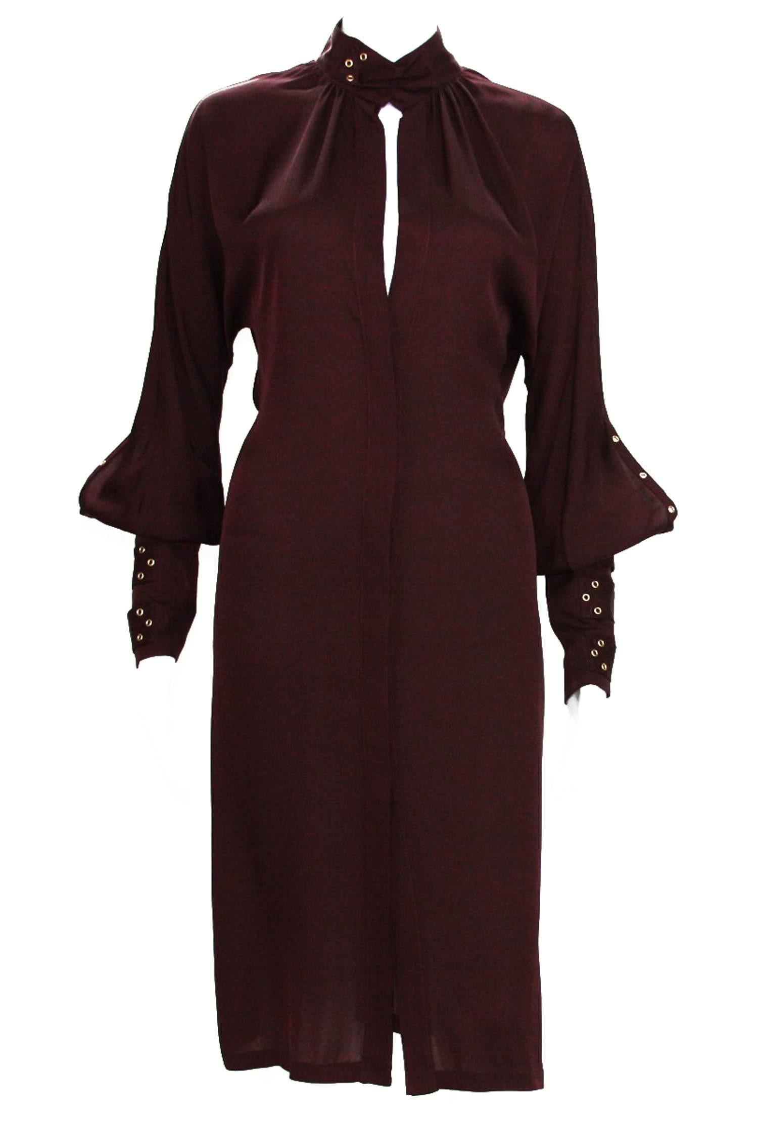  Tom Ford for Gucci Silk Dress
 2003 Collection
 Italian Size 40 - US 4
100% Silk Color - Deep Burgundy
 Hidden Button Closure at Front
 Sleeves Finished with Triple Buckle and Grommet Bands
 Made in Italy.
 Excellent Condition.