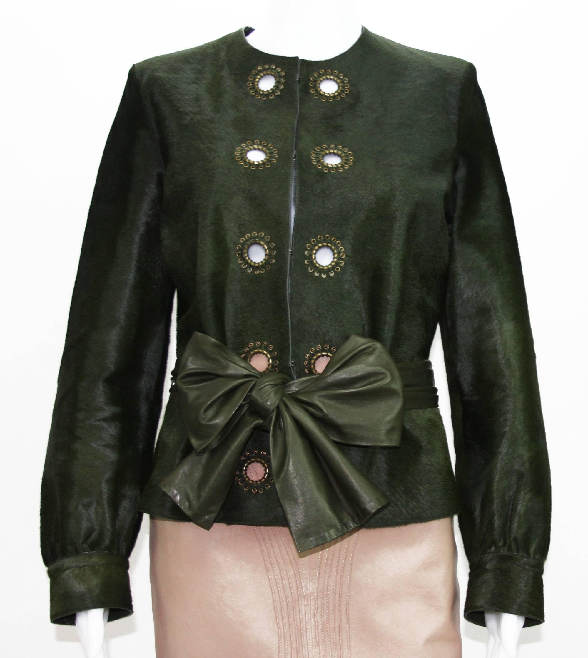 Yves Saint Laurent Leather Jacket.
French size 44
100% Calf Hair, Color - Green, Brass-Tone Eyelet Accents Around.
Hook and Eye Closures, Sash Tie Removable Leather Belt.
Measurements: Length - 24 inches, Sleeve - 24.5 inches, Bust - up to 41