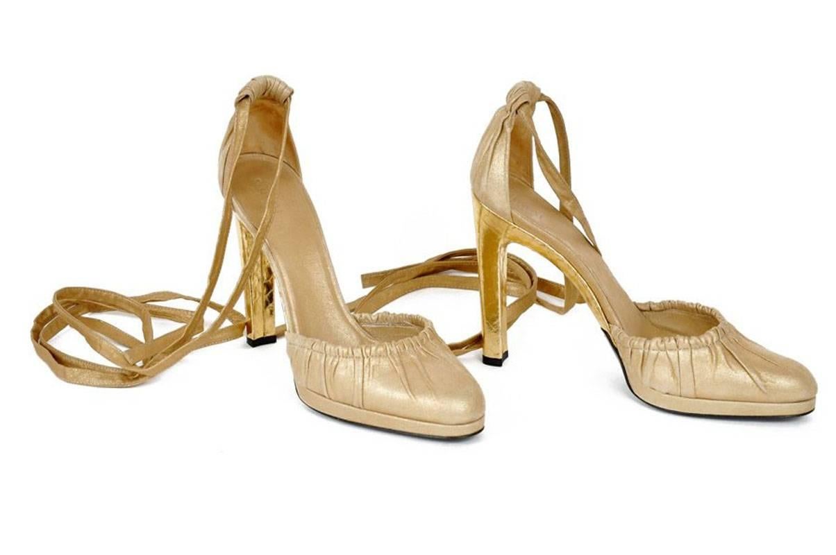 Tom Ford for Gucci Gold Leather Platform Shoes Pumps
Designer Size - 11 B
2004 Collection
Snake Gold-tone Covered Heel - 5 inches
Leather Straps
Color - Gold
Platform Approx. - 0.5 inches
Leather Sole and Insole
Made in Italy
New without original